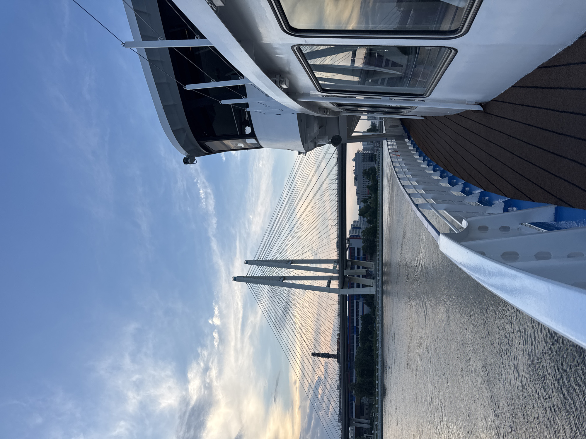 Boat ride along a Russian river past a cable-stayed bridge
