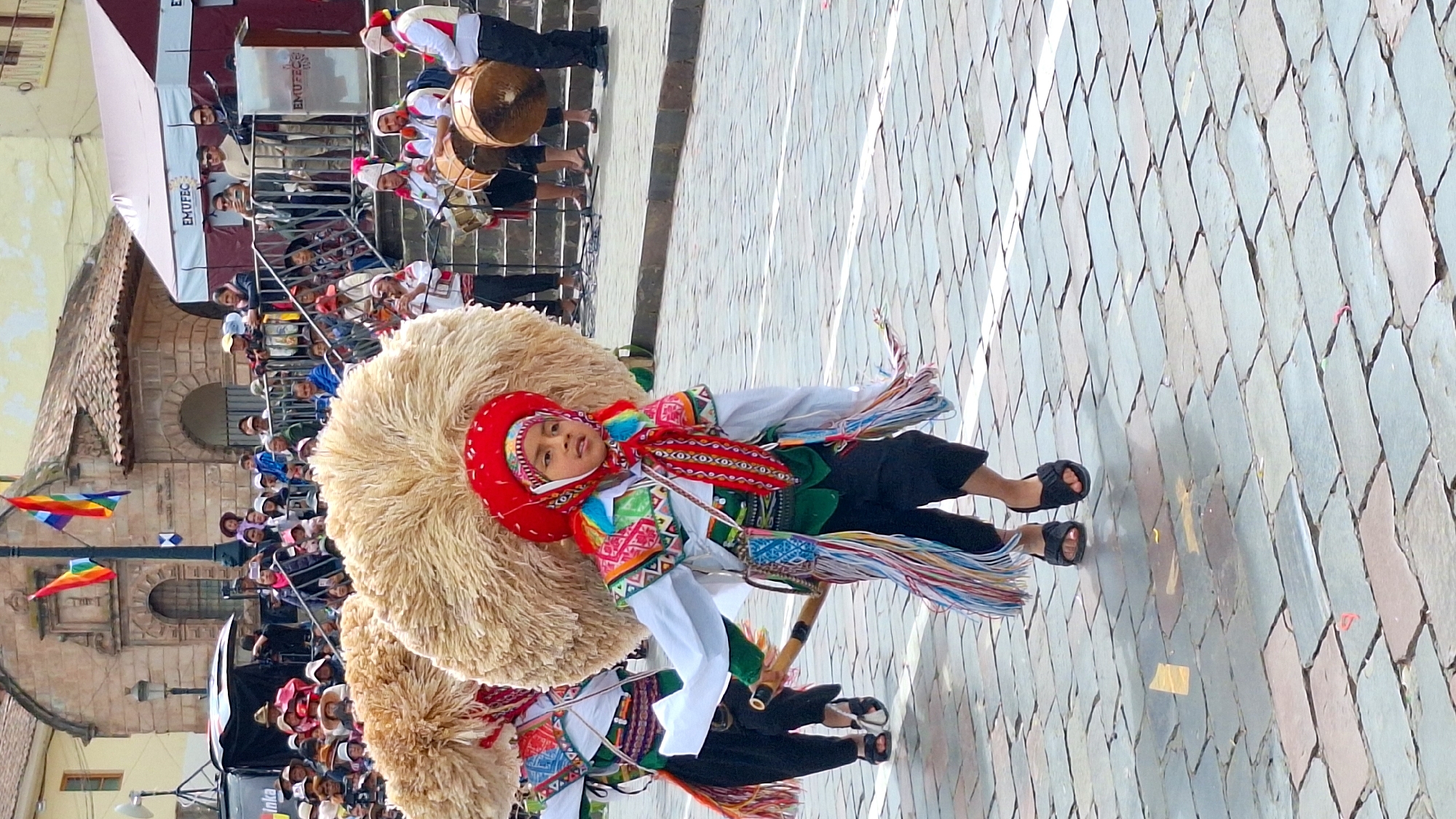 Children parade in traditional dress during Cuzco cultural festival