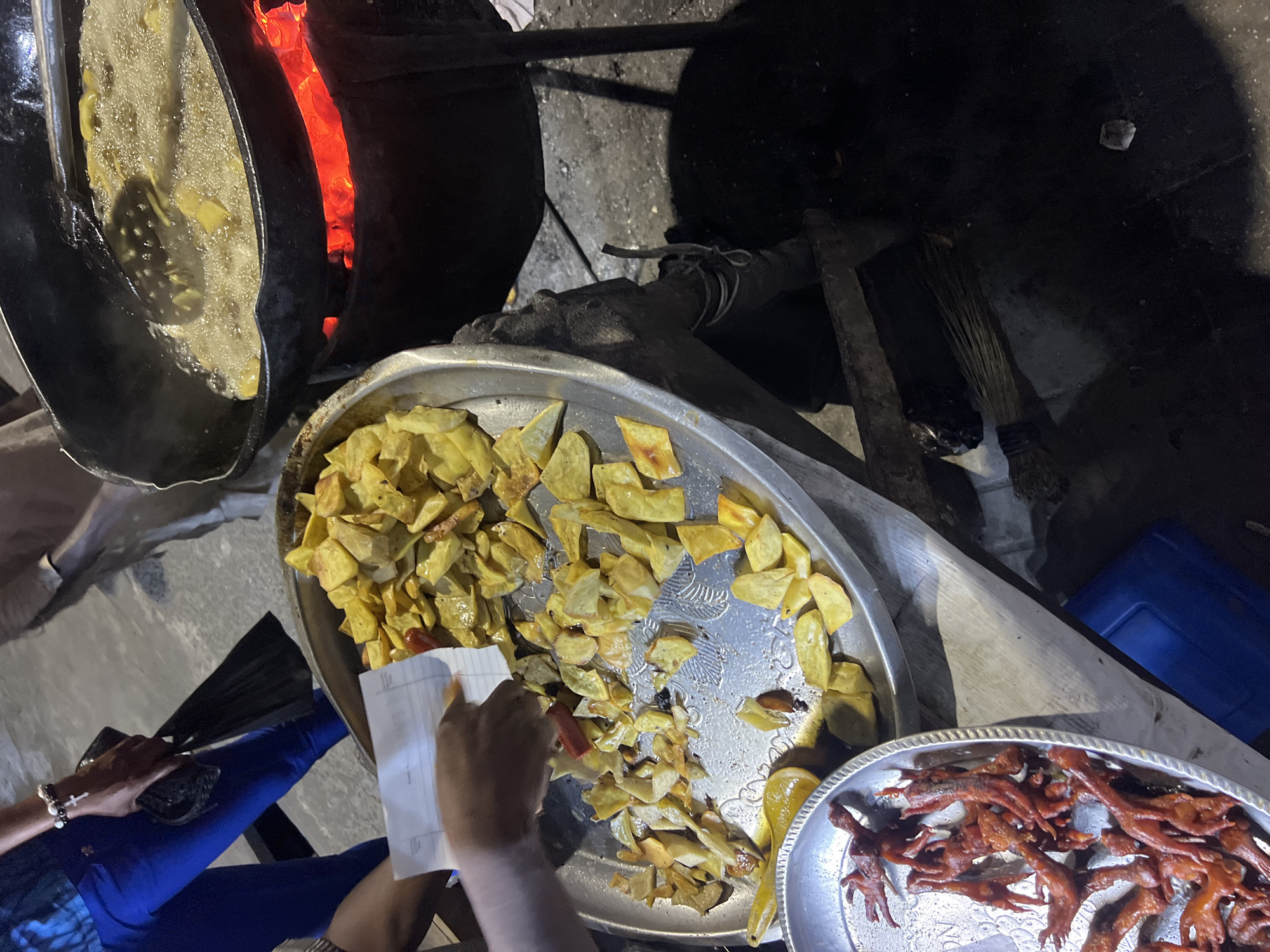 Street food vendor operates cooking stall in Lagos
