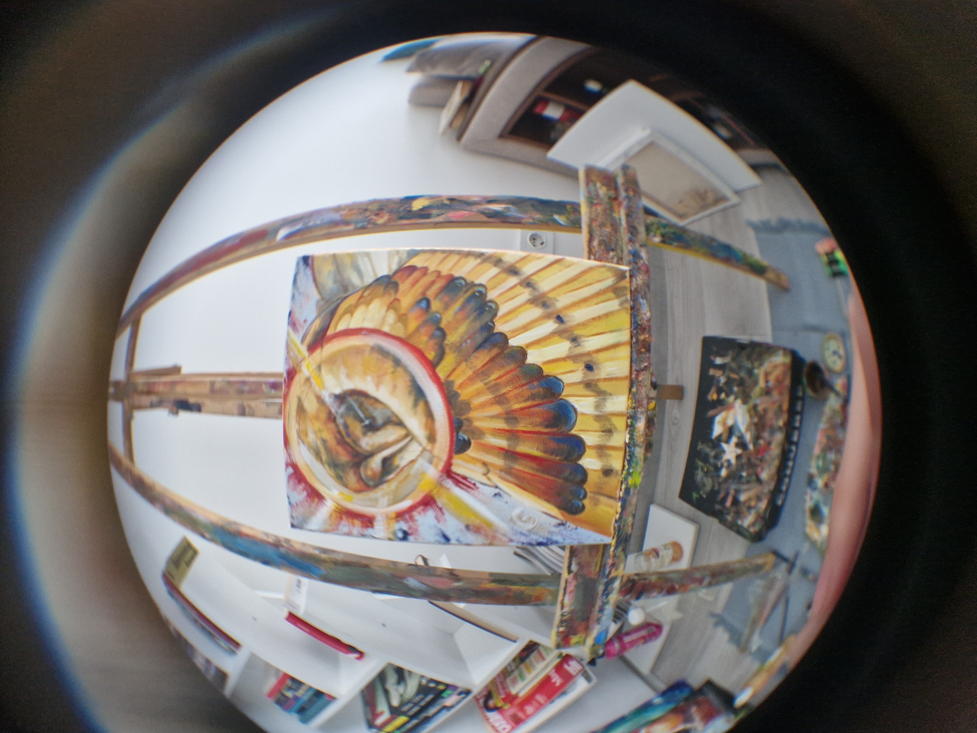 Artist's studio with abstract feather painting documented