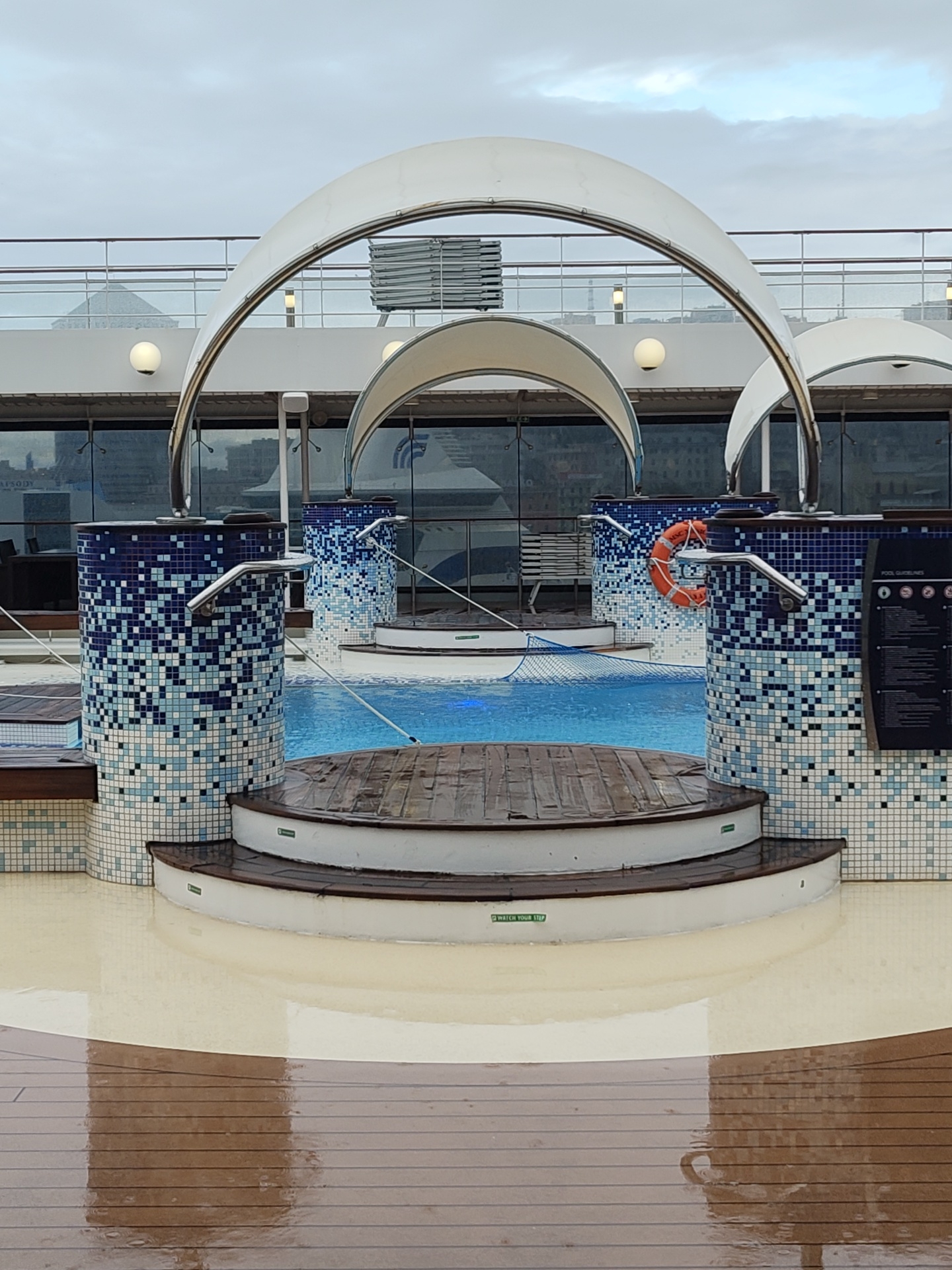 Morning rain scenes captured in Genoa's port and cruise ship