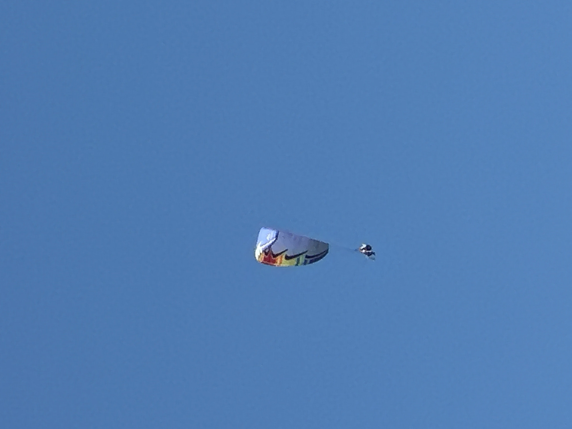 Paragliders and parasails fill the skies above Boreti's Adriatic beach