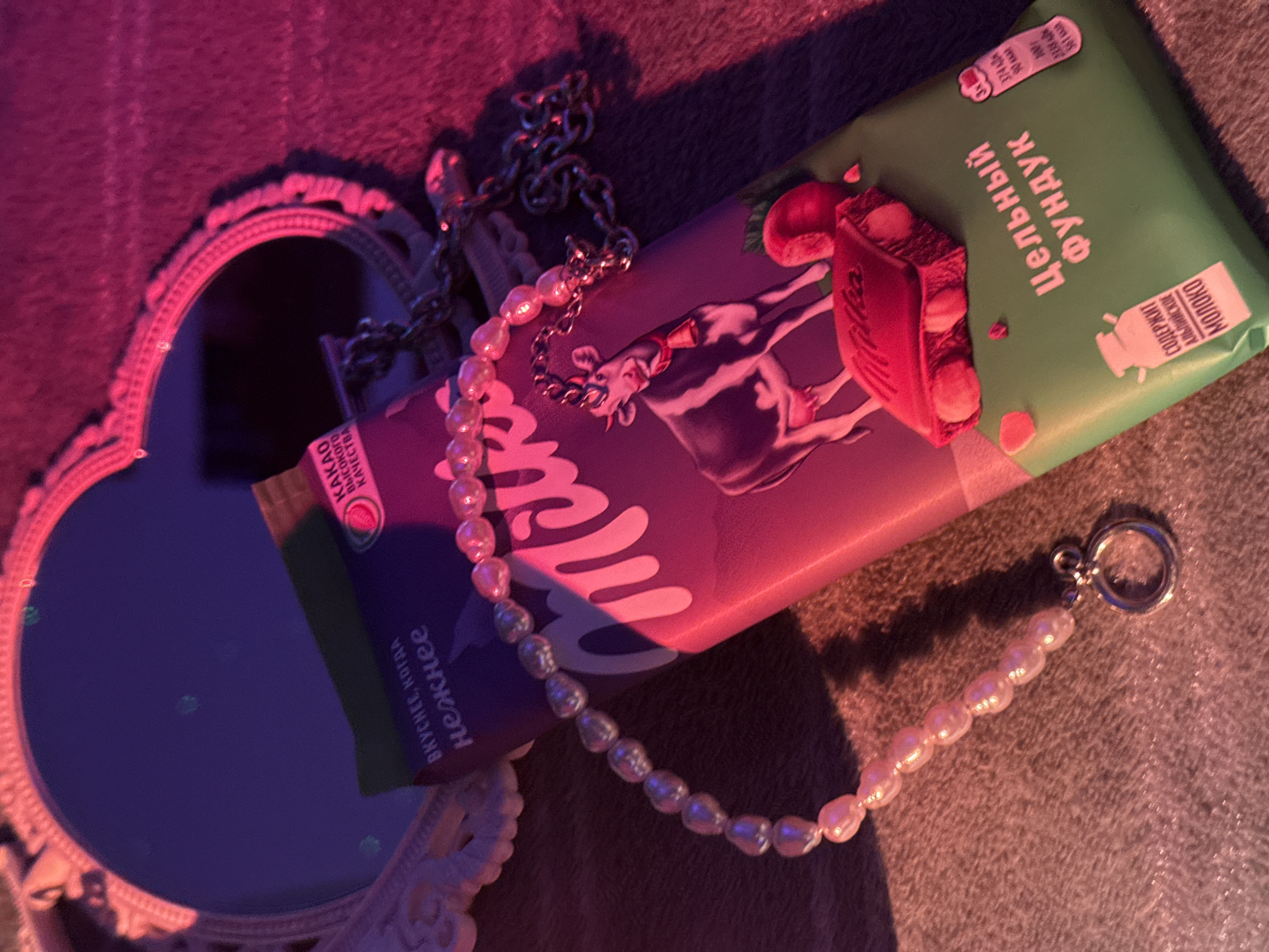 Russian book displayed with jewelry under colored lighting
