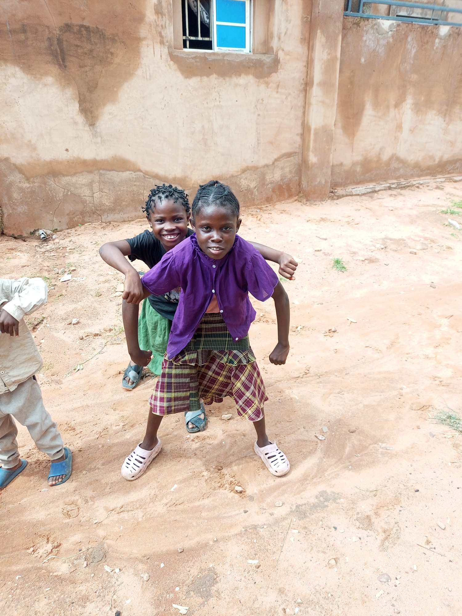 Everyday moments outside a building in Gombe, Nigeria