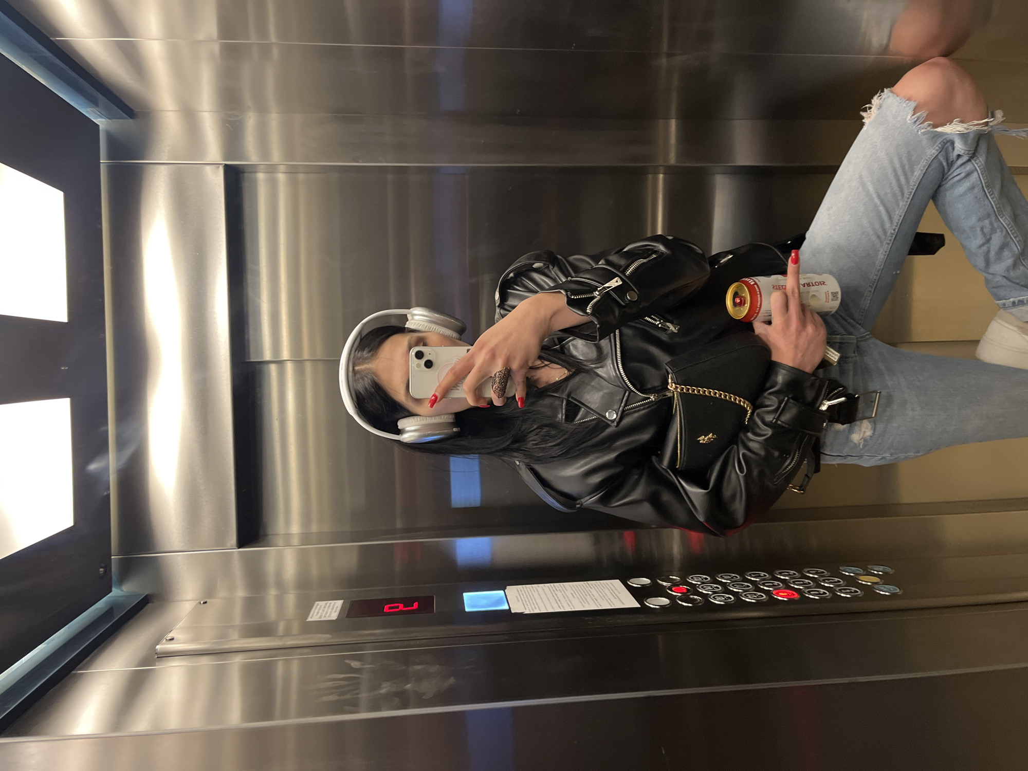 Elevator selfie and a metallic dragonfly sculpture, same night