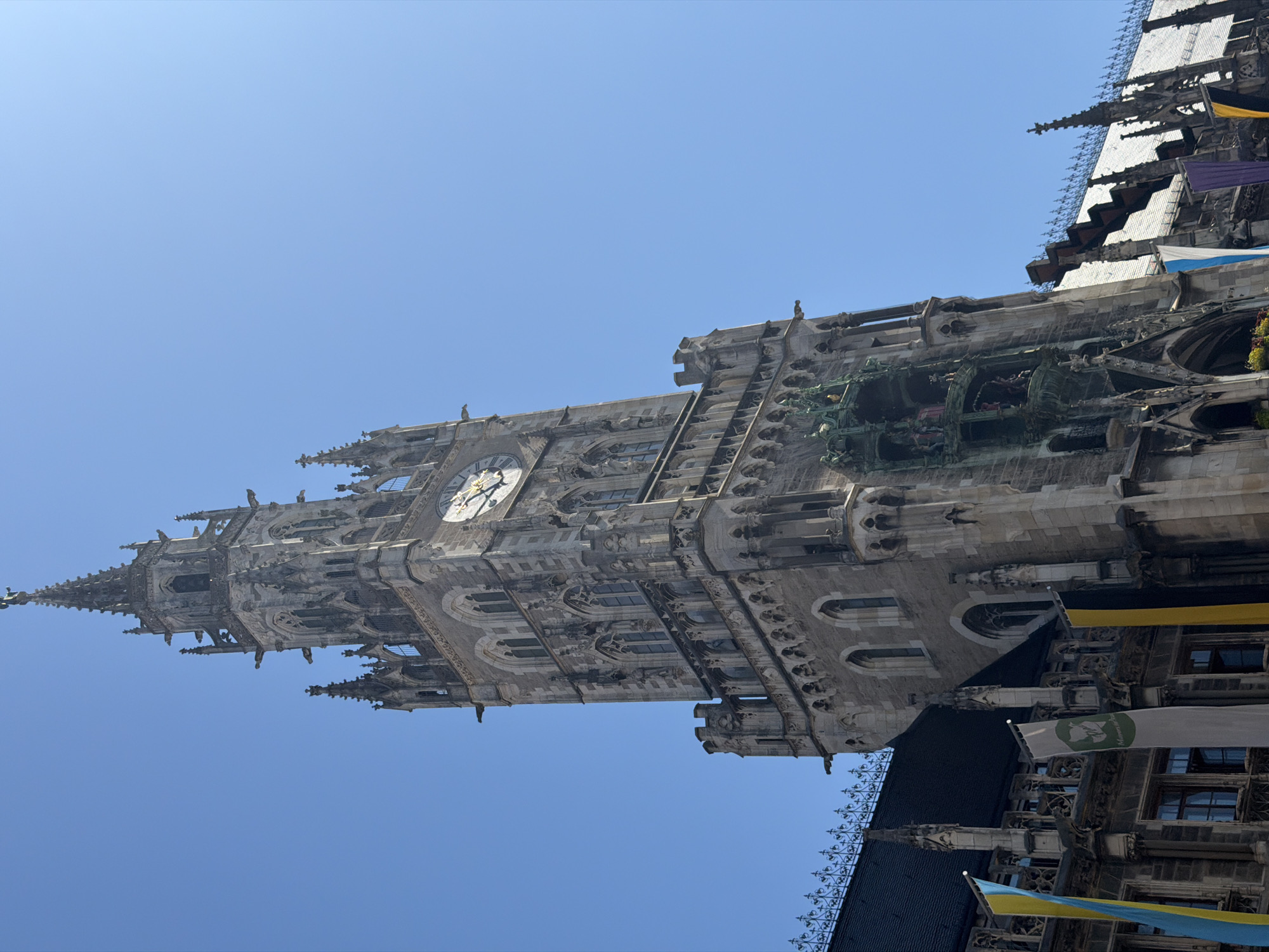 Up-close look at Munich's Neues Rathaus on a clear summer morning
