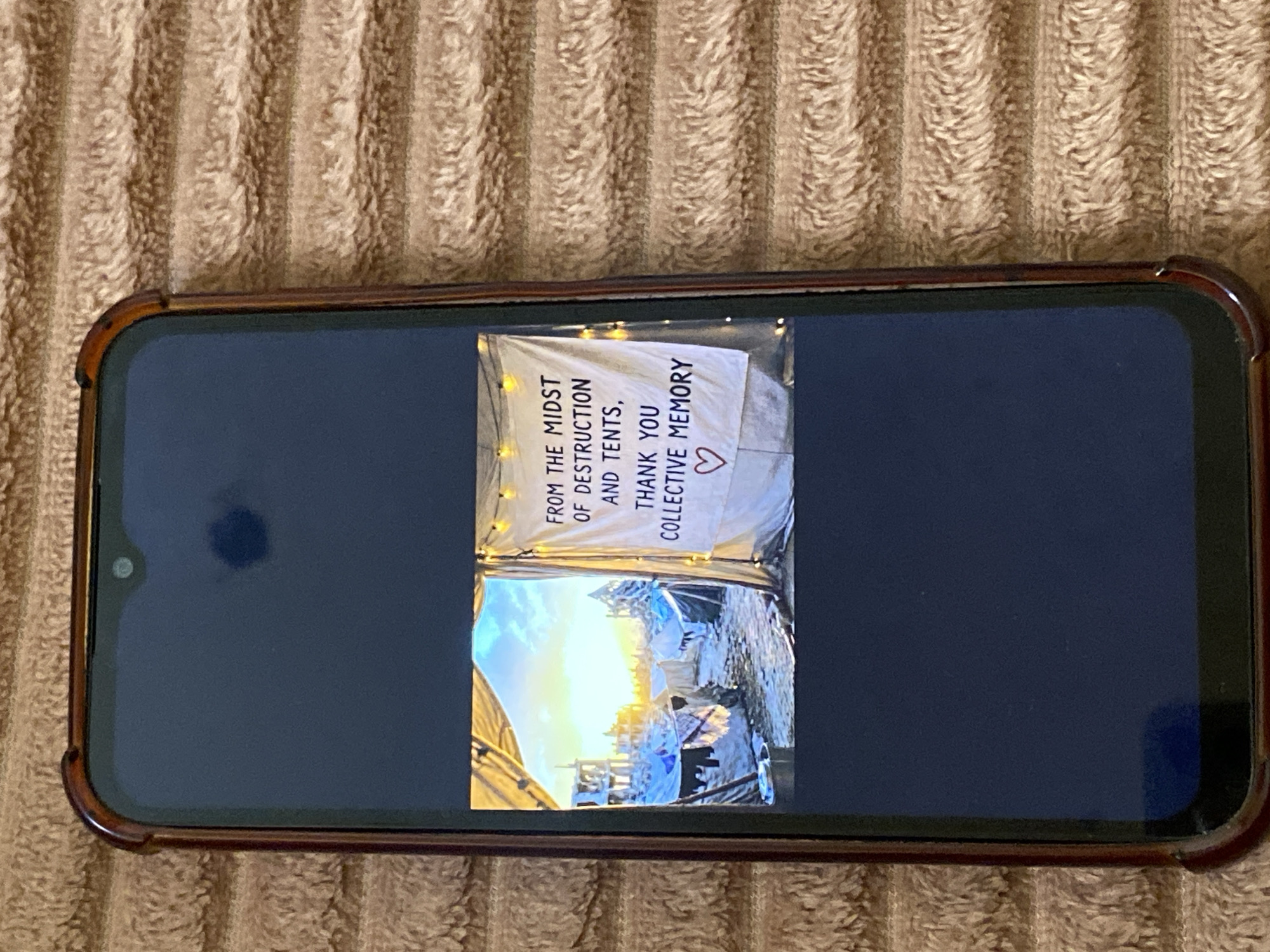 Smartphone with rotated screen display observed in al-Qarara