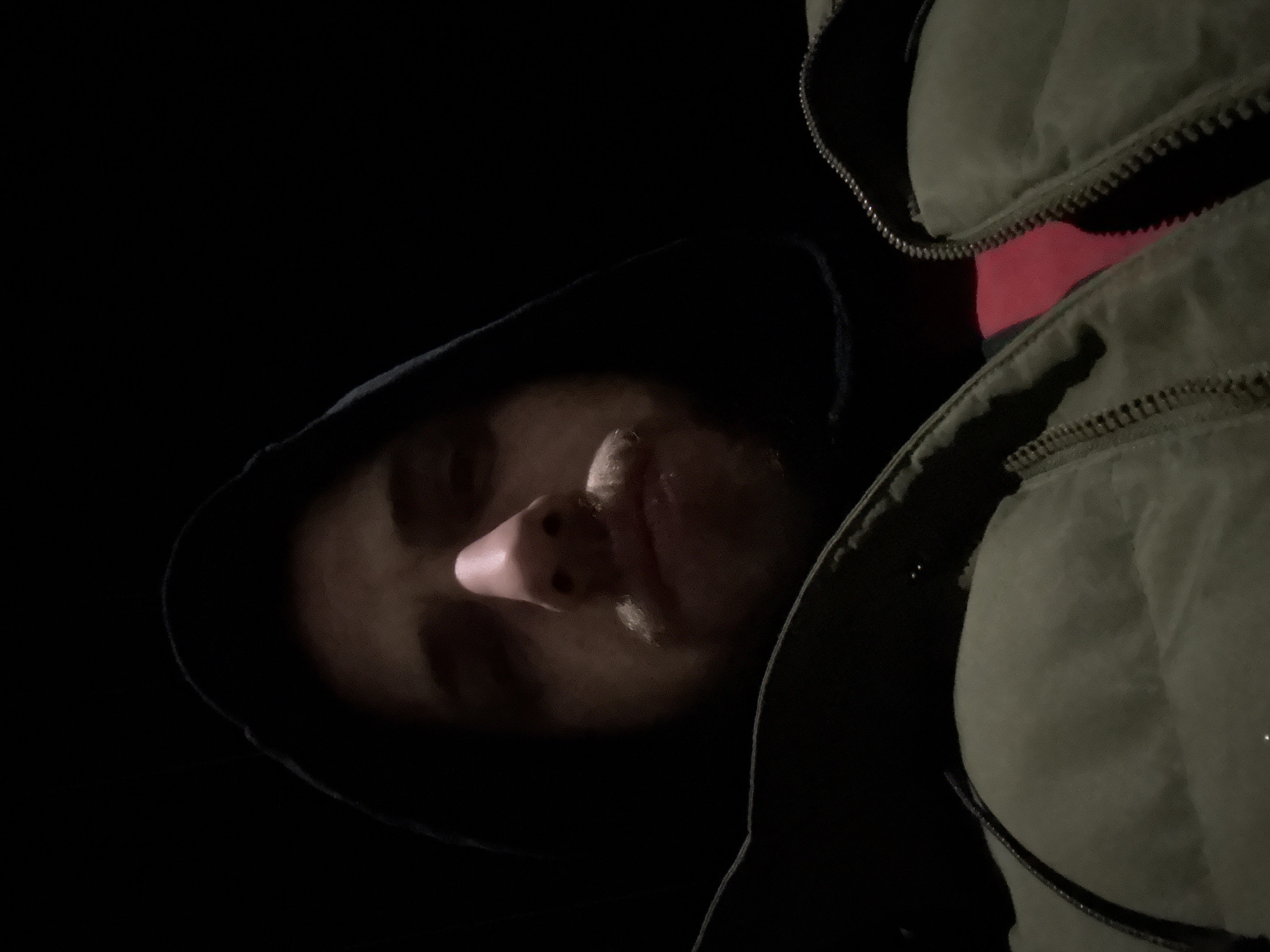 Person in layered clothing spotted looking upward in Samokov