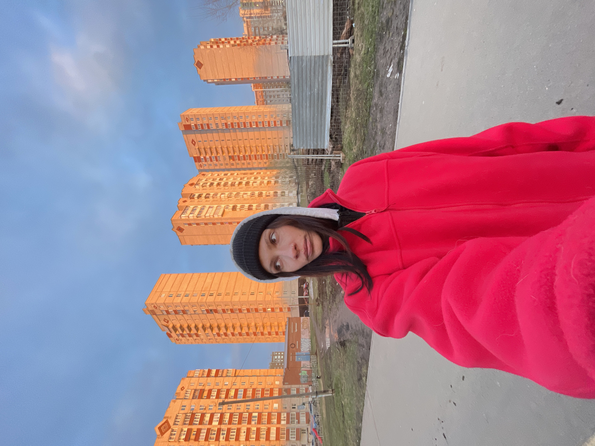 Woman photographed with dog in urban Izhevsk setting
