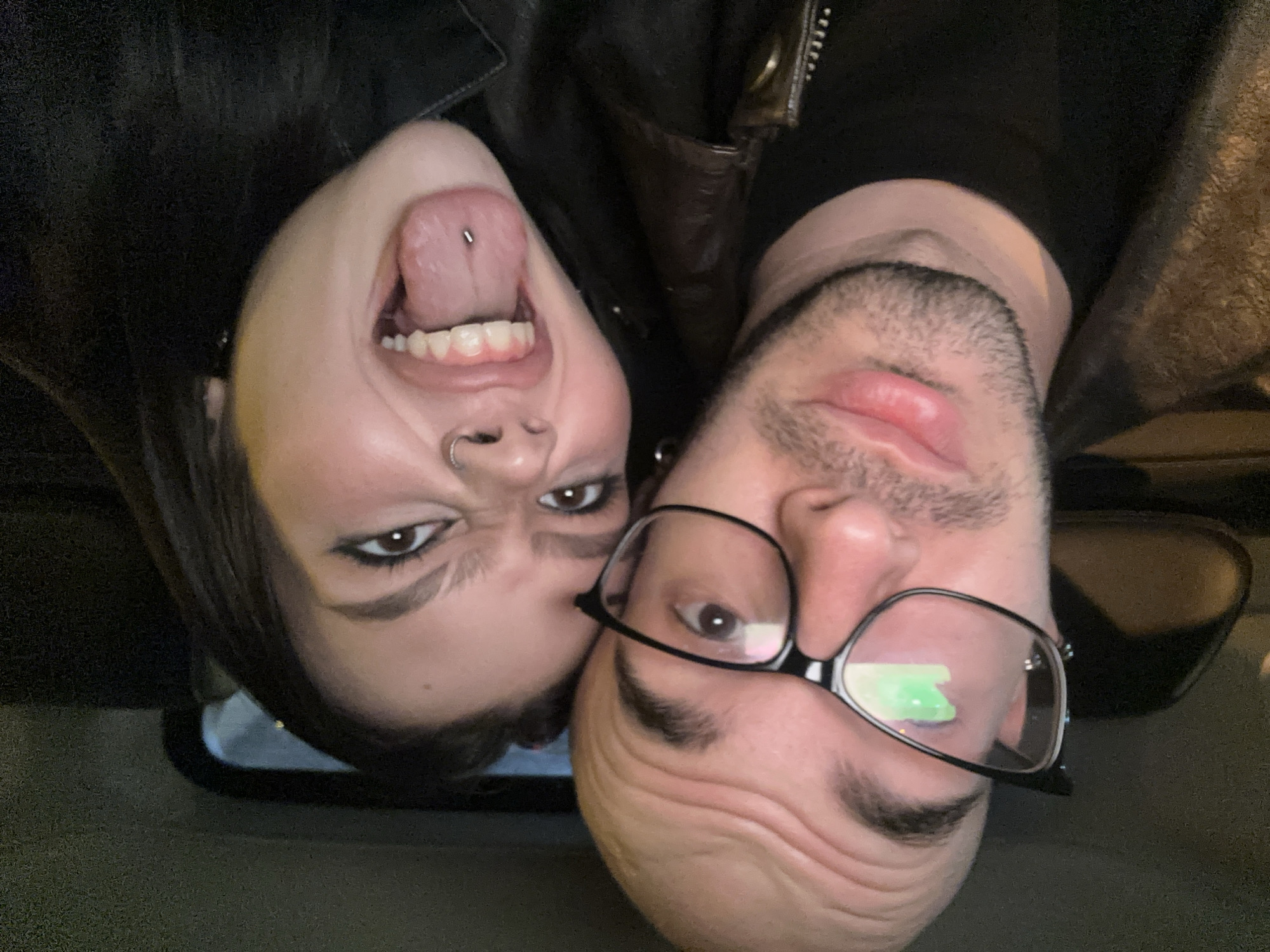 Couple takes playful selfies in car in Moscow
