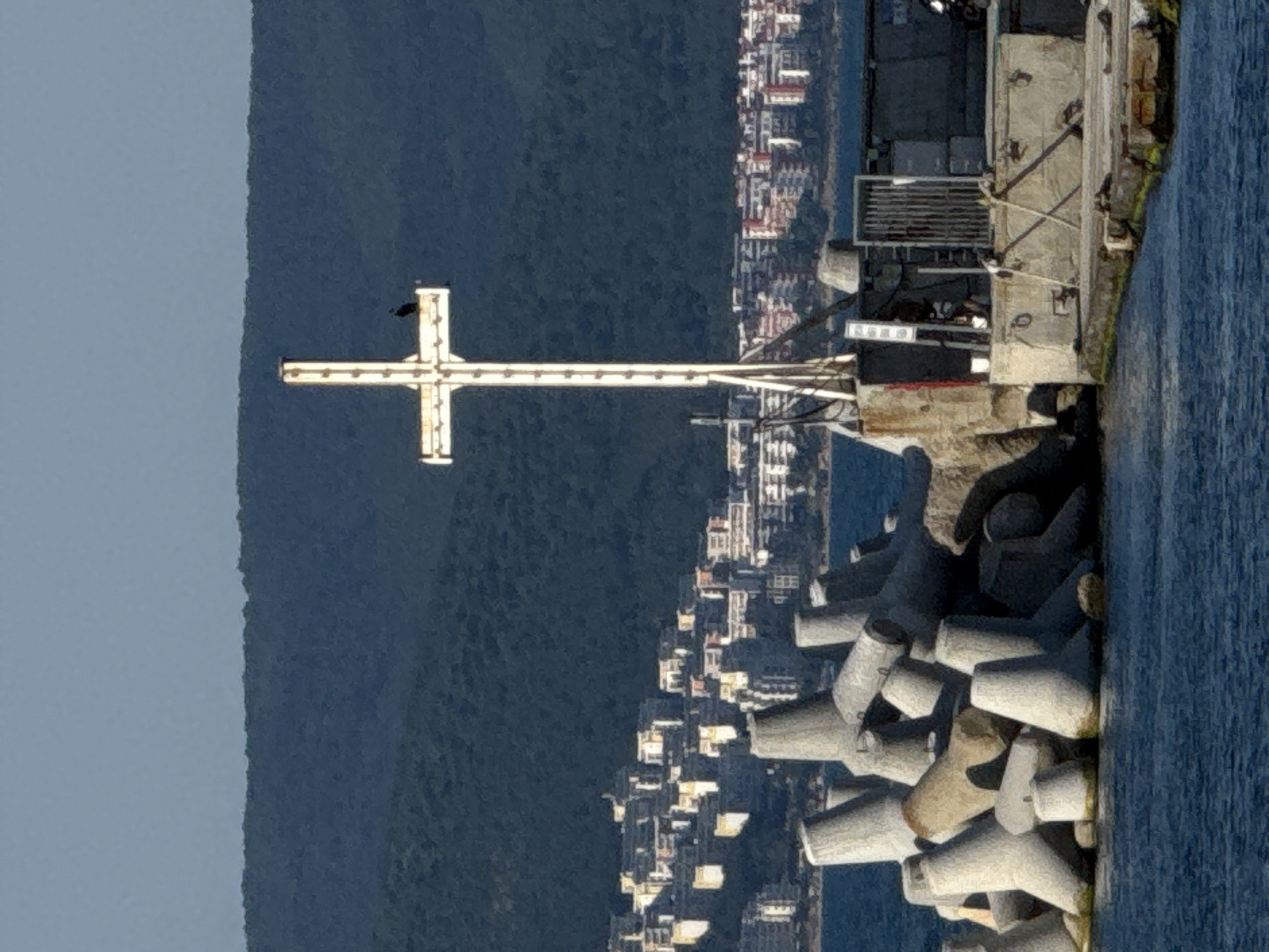 Nesebar's harbor promenade: windmill, pier cross, and summer boats