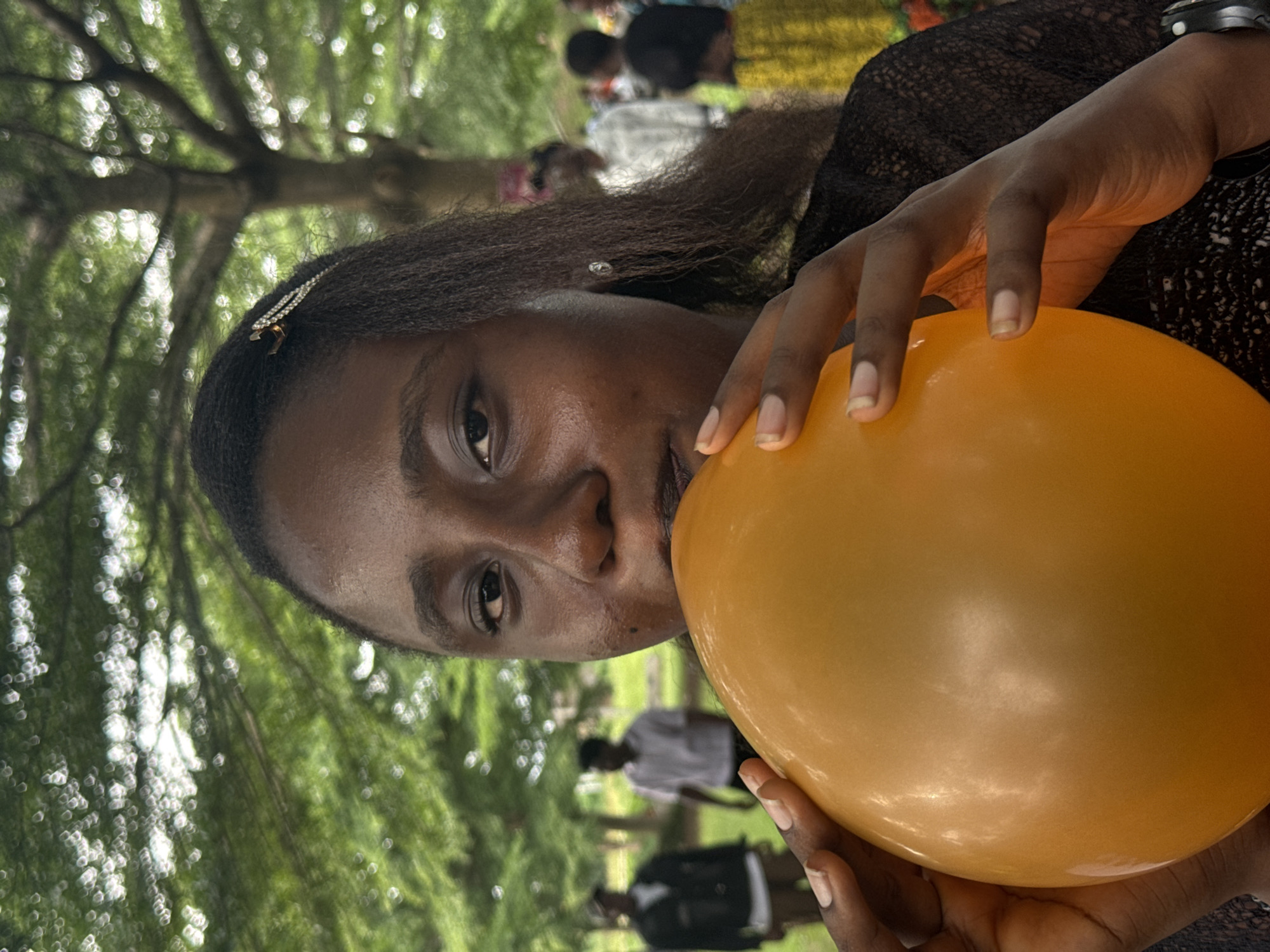 Women gather with balloons outdoors in Ihiagwa, Nigeria