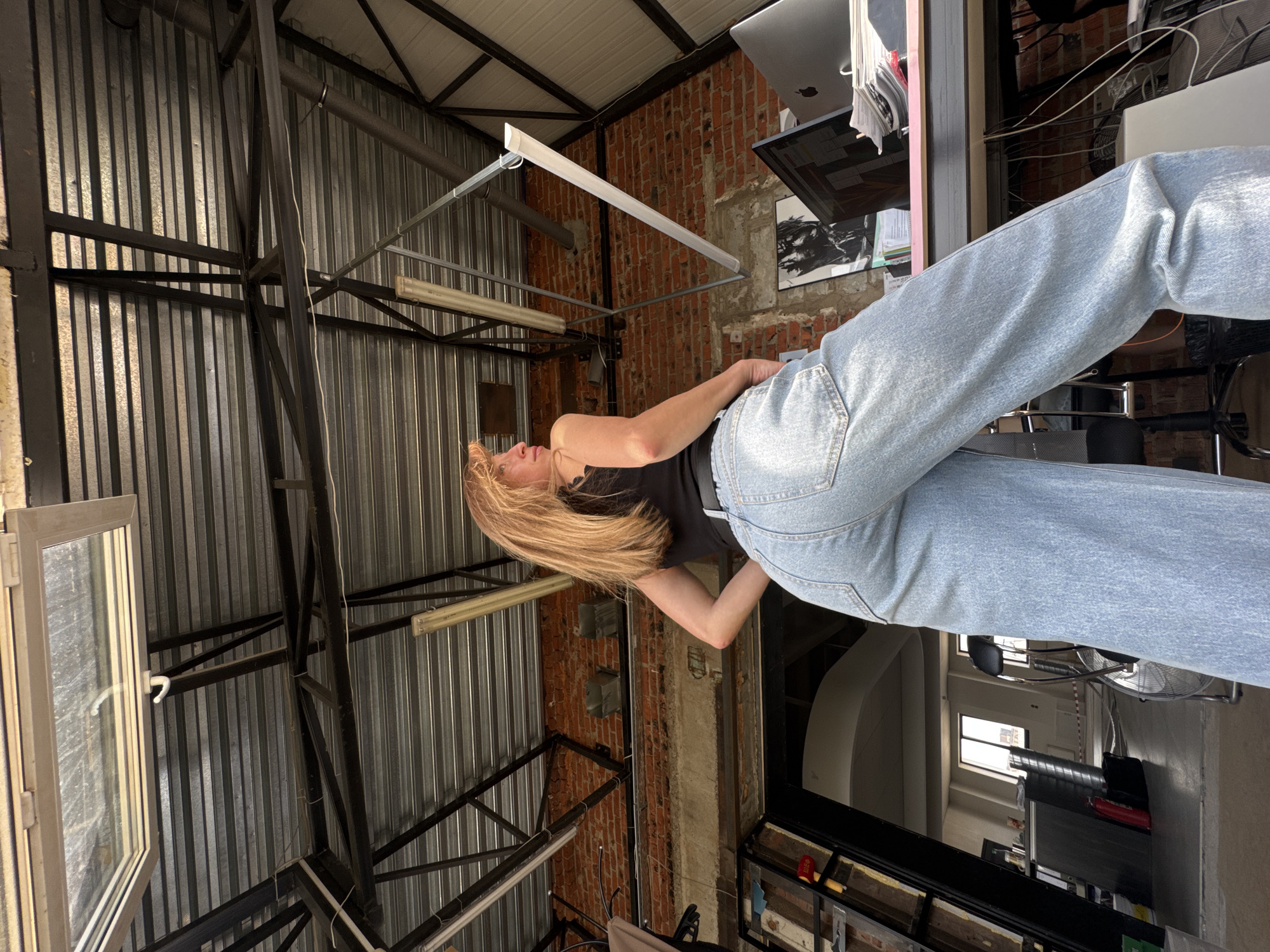 Woman's morning routine captured in Chaikovsky industrial workspace