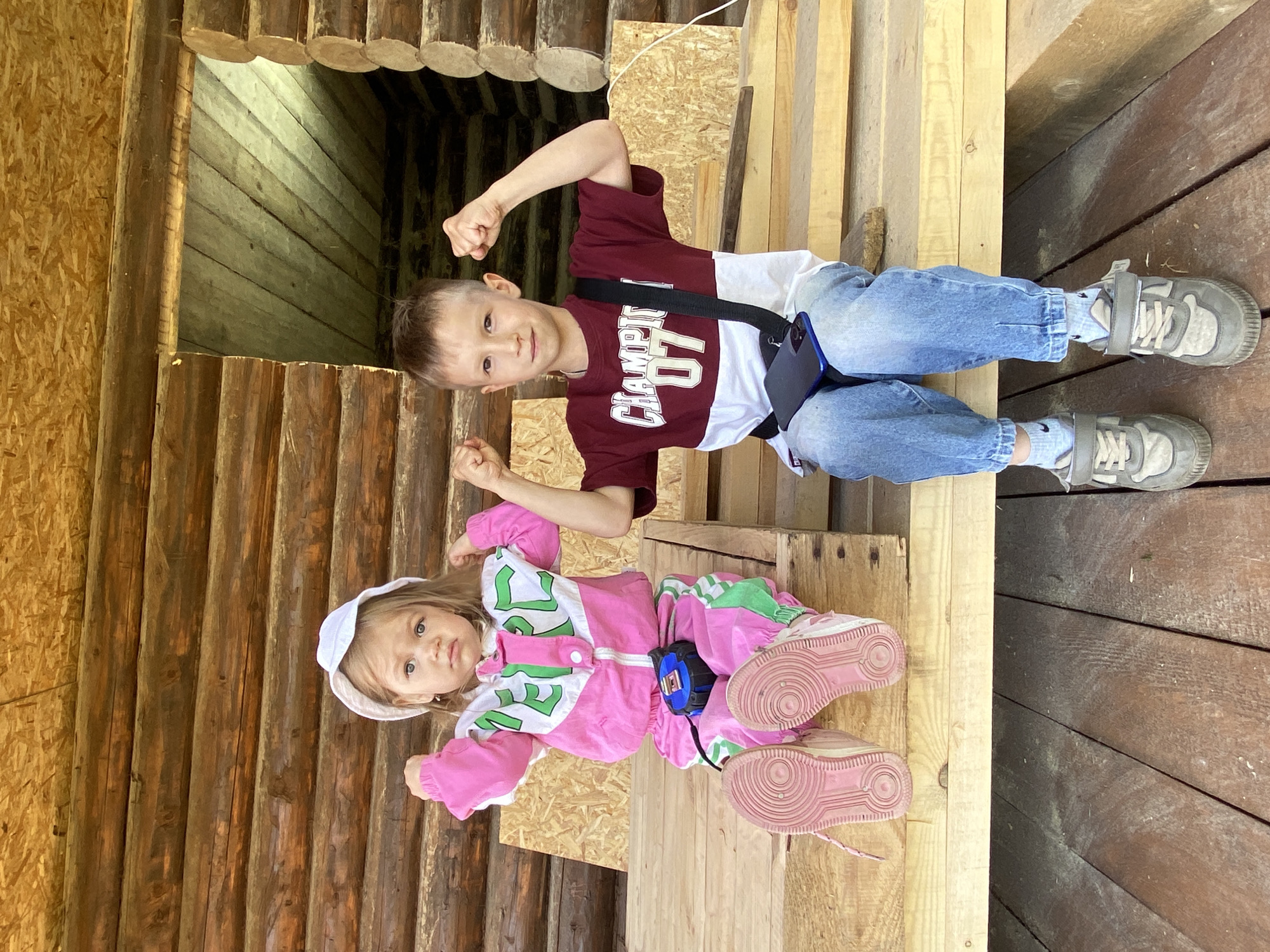 Family moments captured at log cabin construction site in Chaikovsky