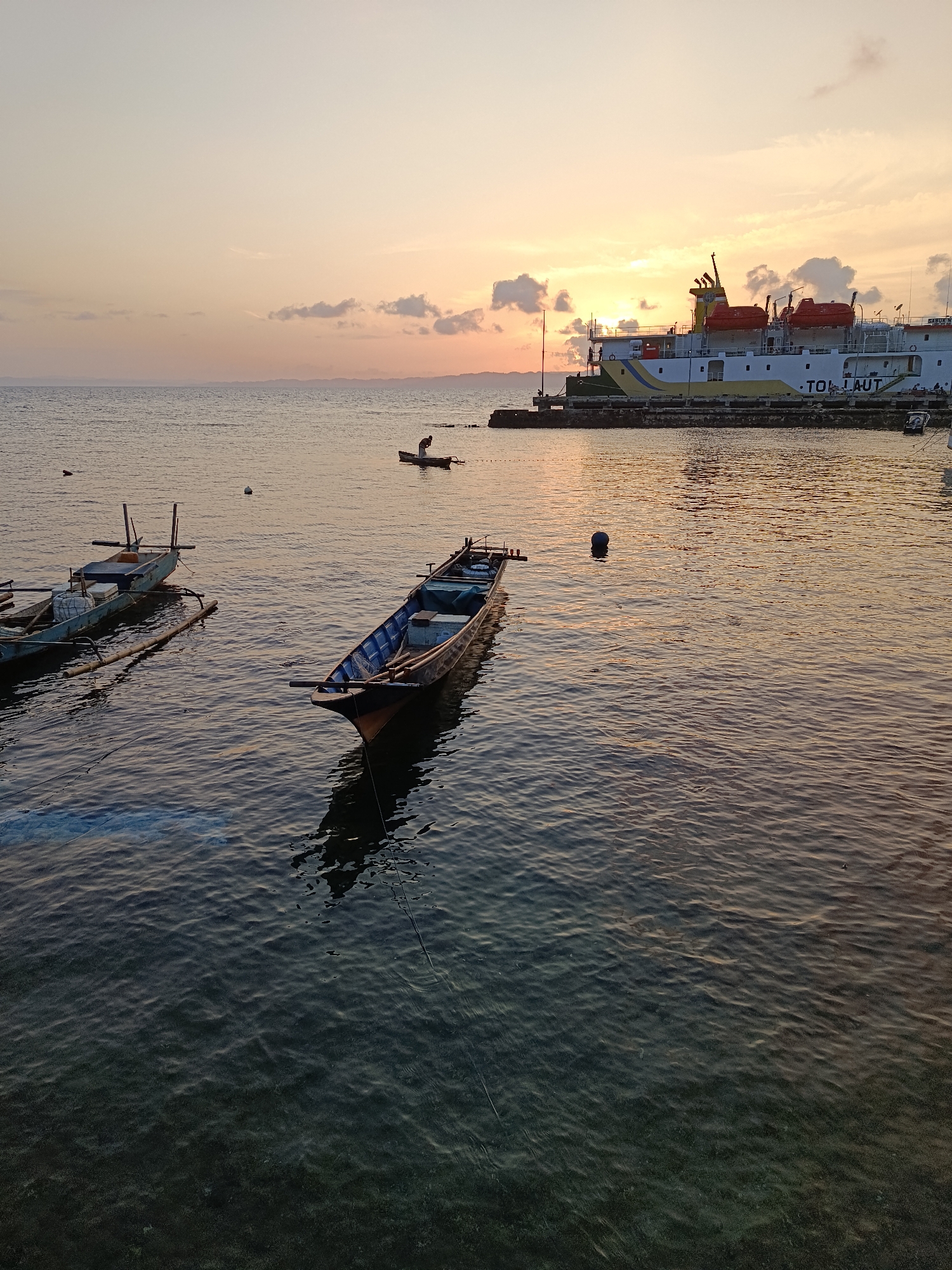Sunset at Mansalean port with multiple vessels docked