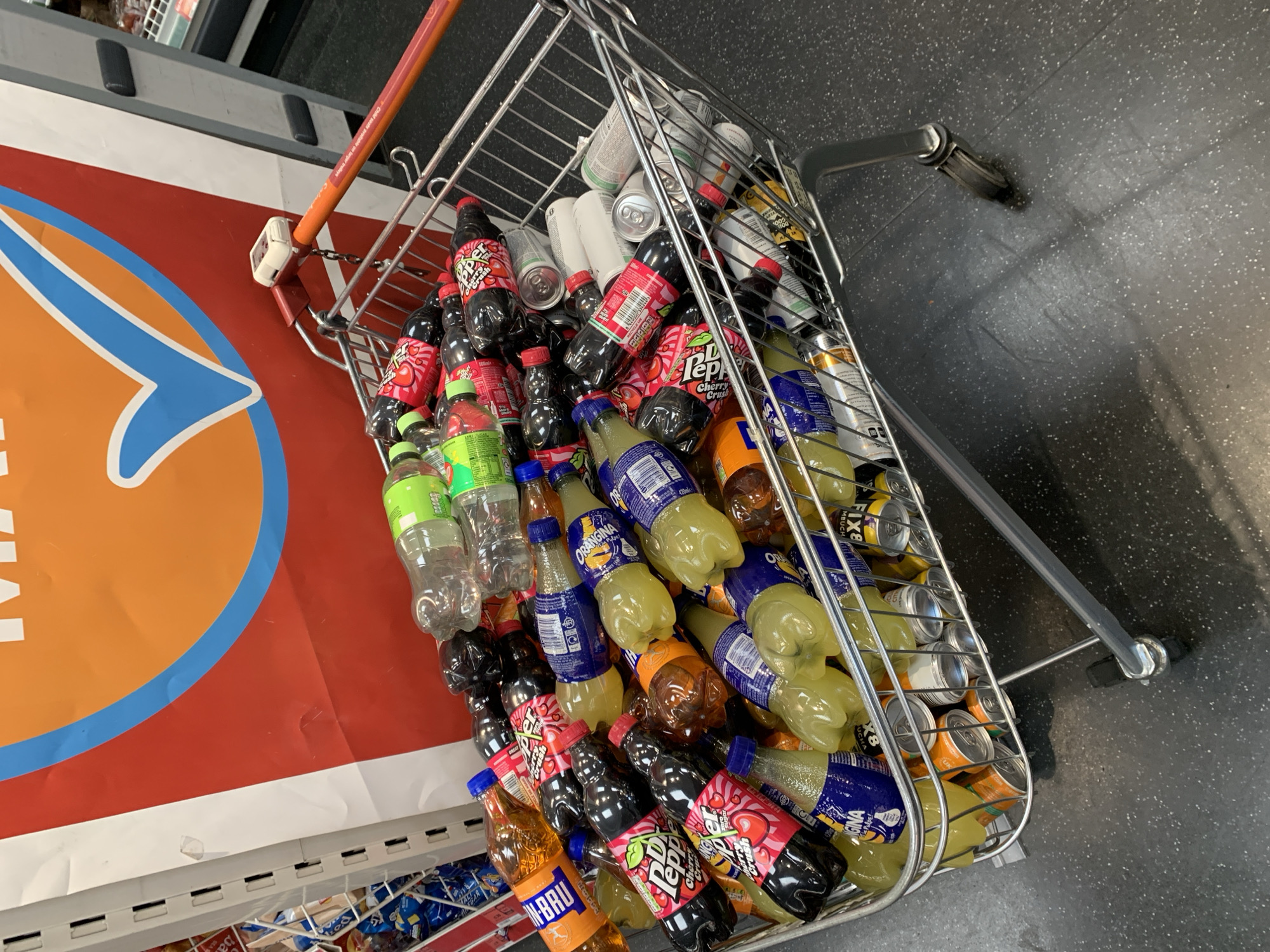 Shopping cart with beverages spotted in London store aisle