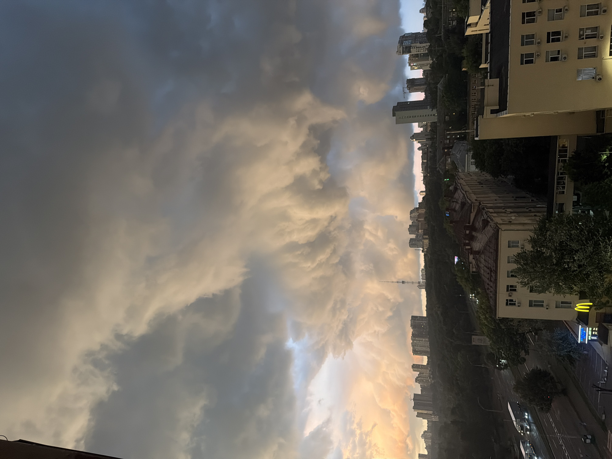 Storm clouds roll over Kyiv's skyline on a June evening