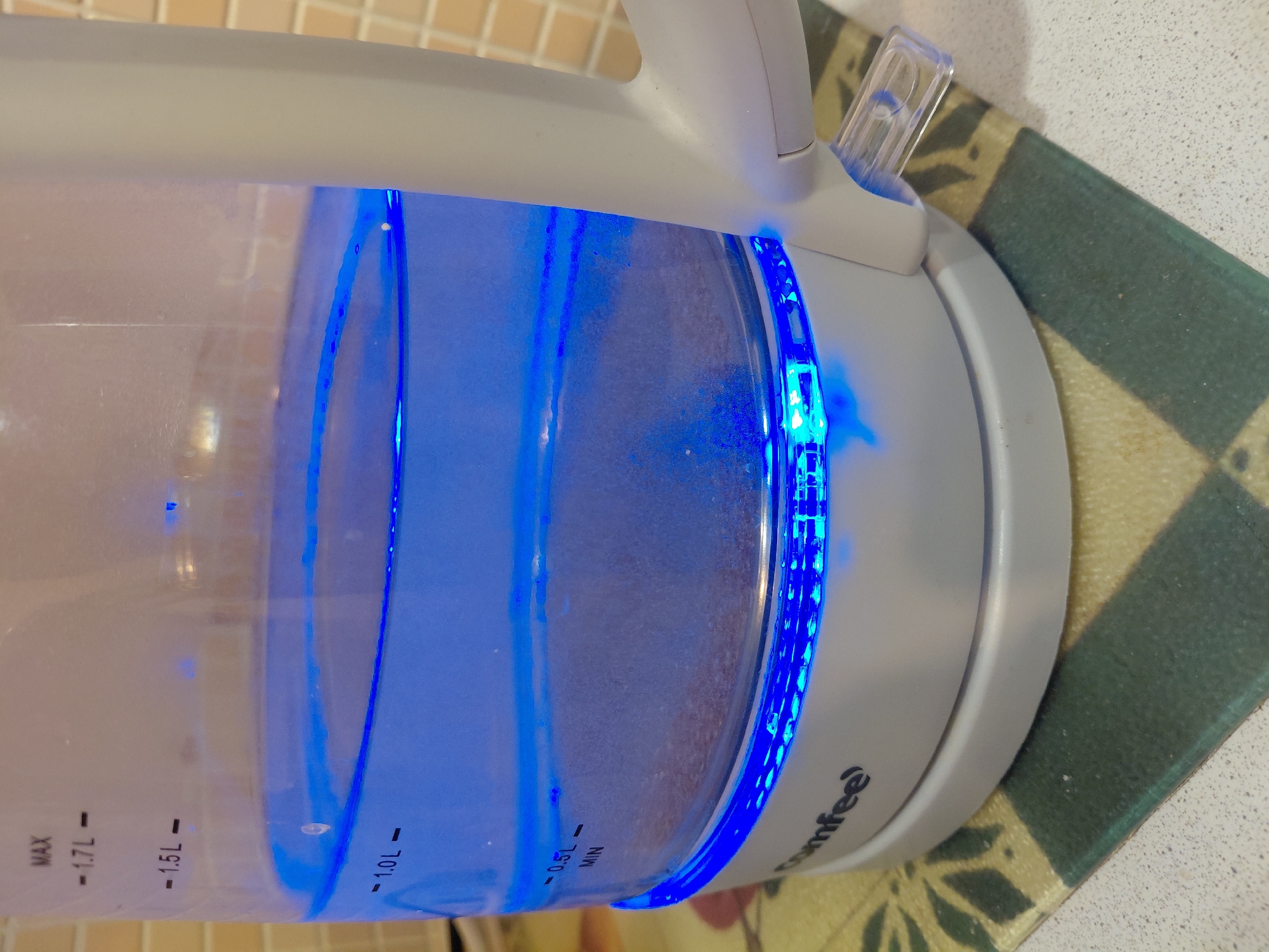 Electric kettle heating water with blue LED in Nadym
