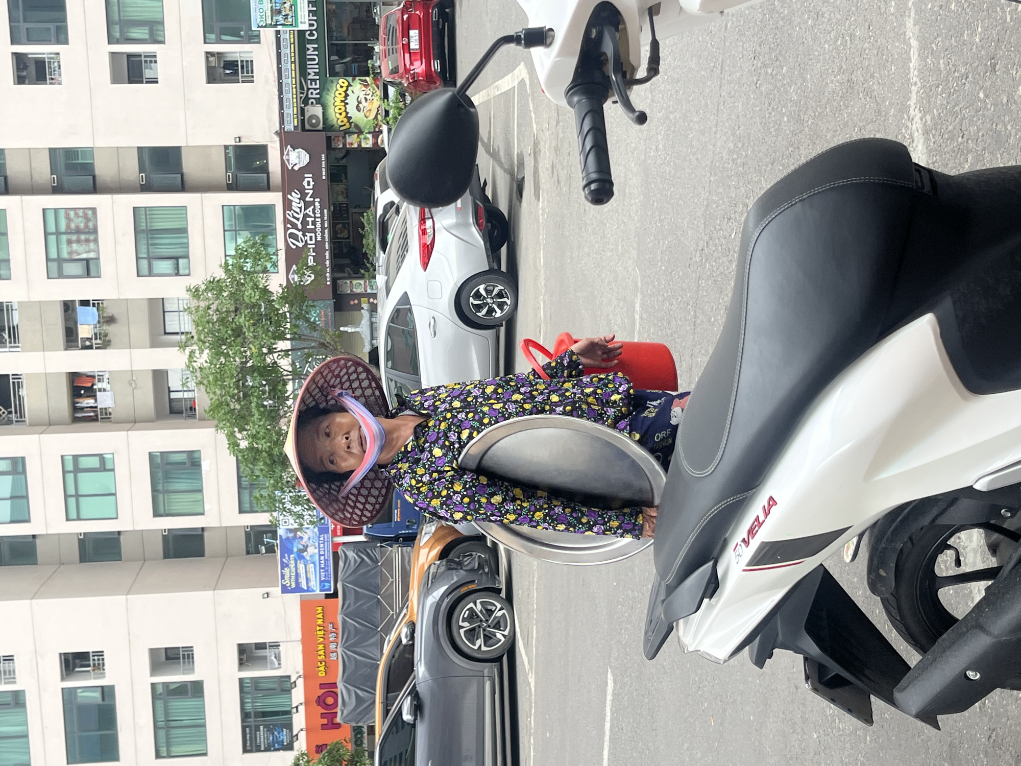 Daily life documented in Vietnamese urban district over hour