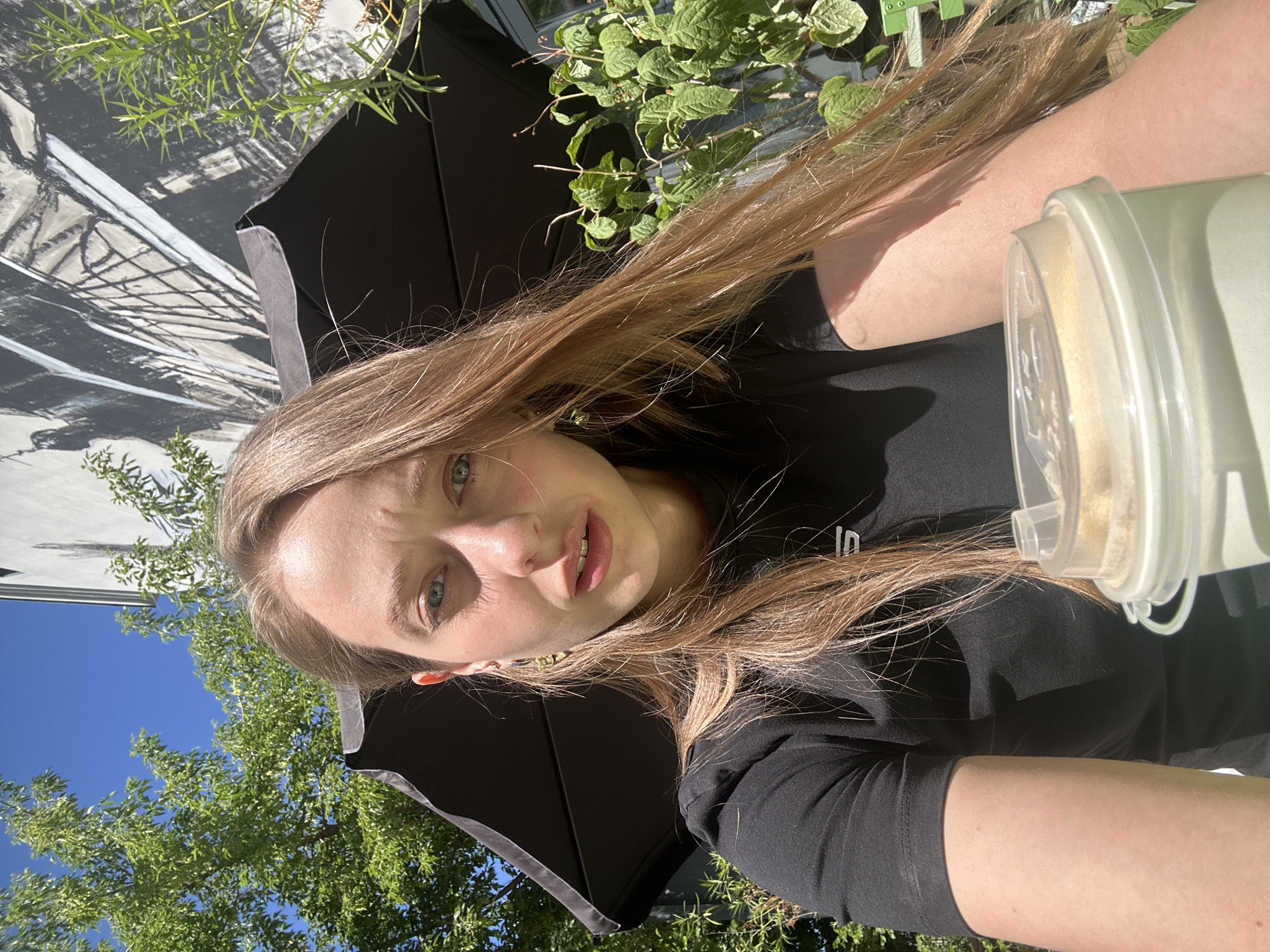 Coffee and selfies at a sunny Moscow café terrace