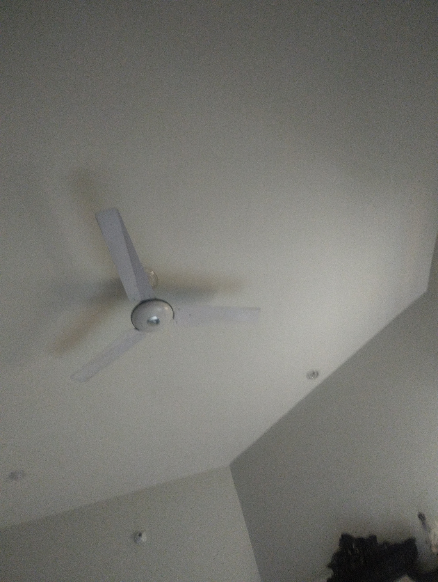Inside a bedroom: furniture, fabrics, and ceiling details