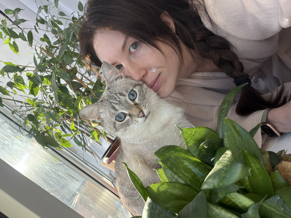 Woman documents morning routine with skincare and cat in Perm