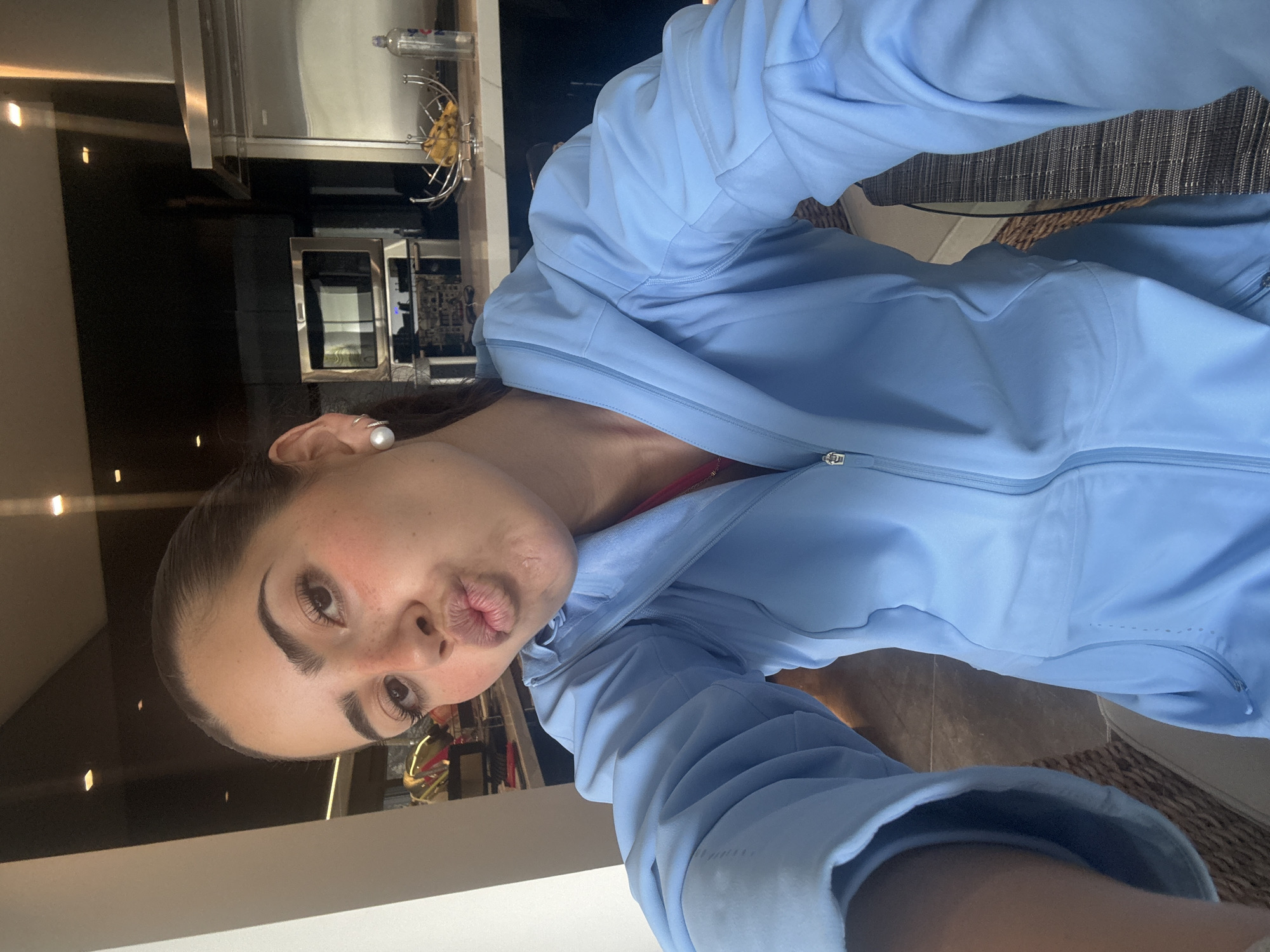 Woman takes playful selfies at Mexico home during evening