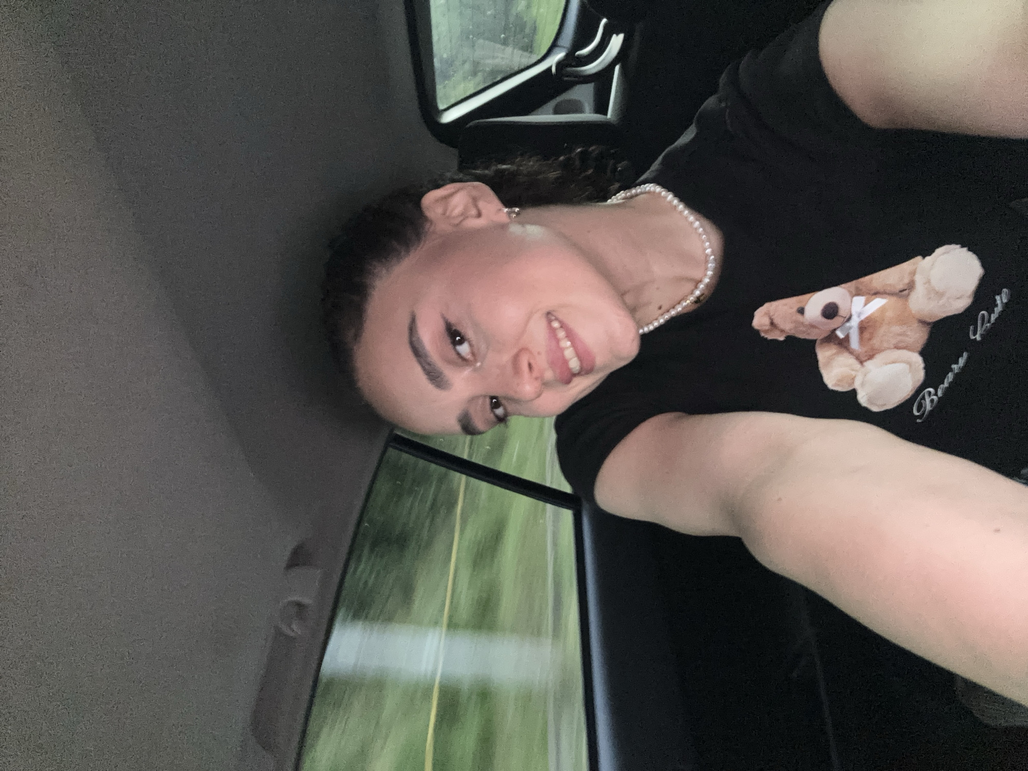 Woman in teddy bear shirt rides through Tbilisi