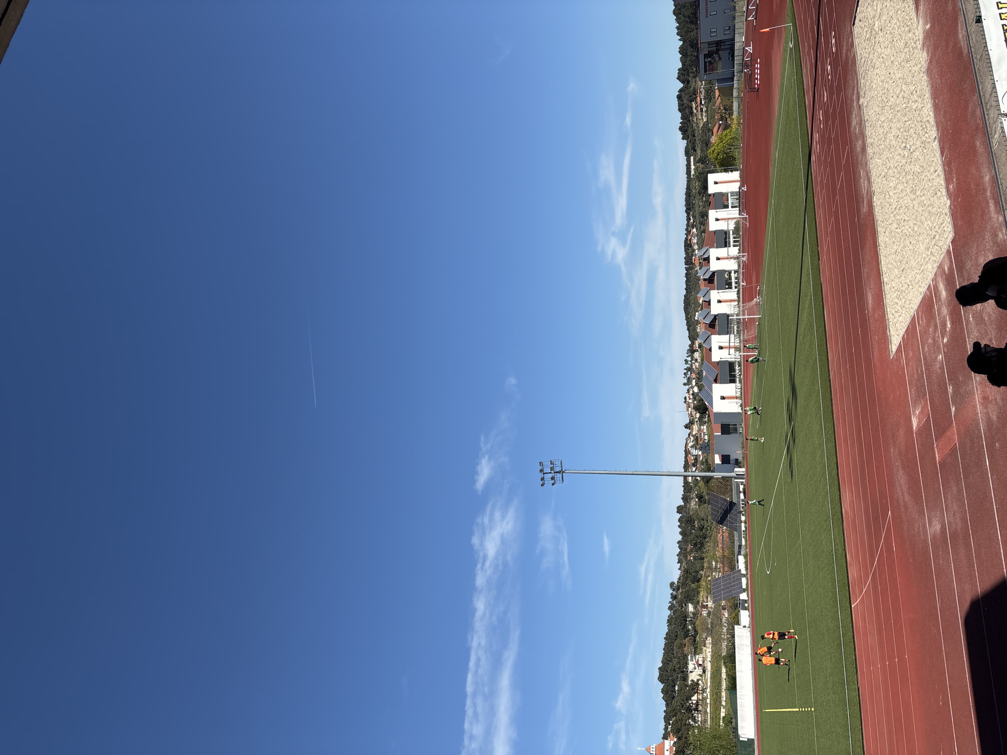 Afternoon gathering at Valpaços stadium during field maintenance