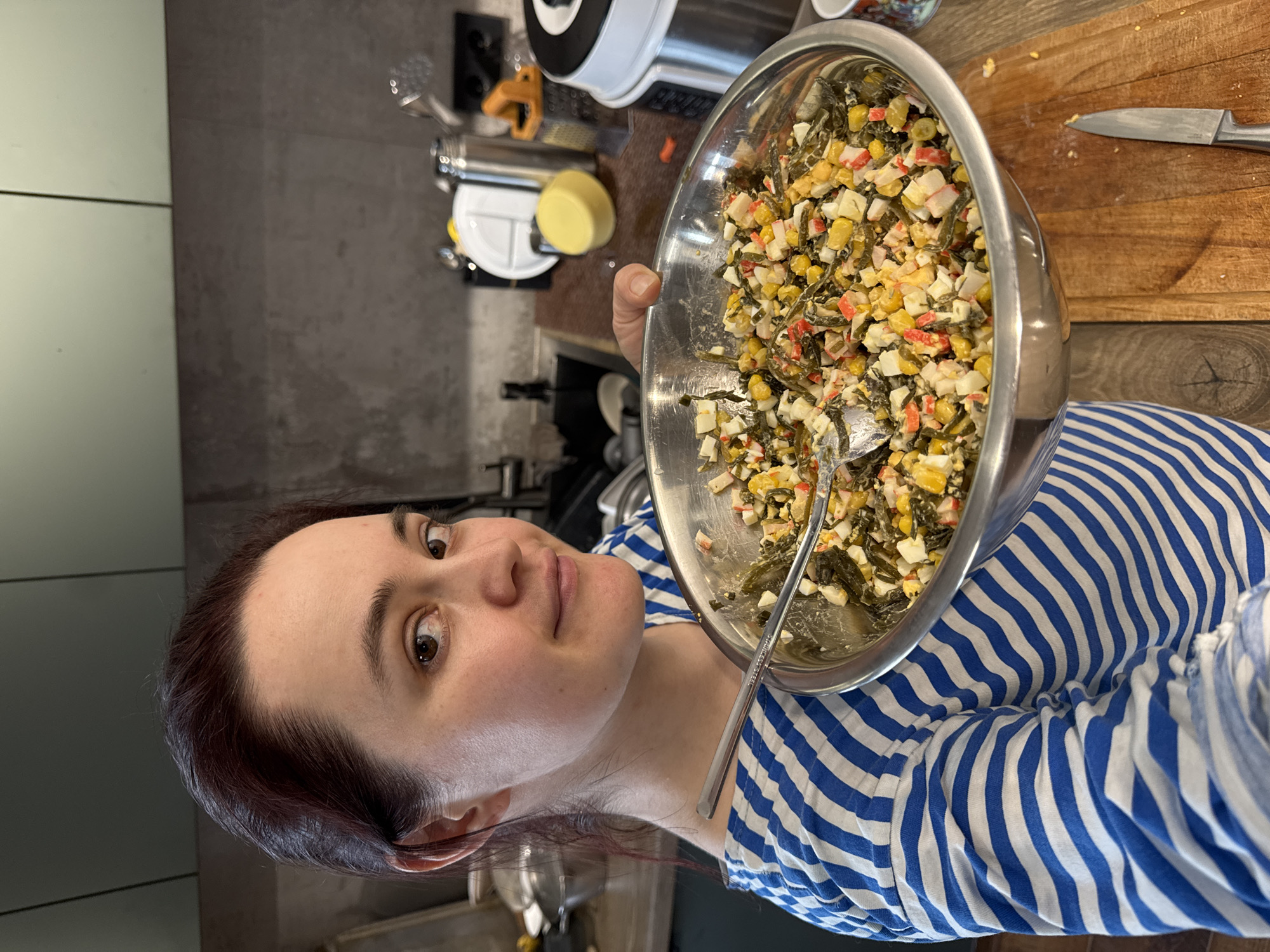 Person enjoys seafood salad lunch in Izhevsk, Russia