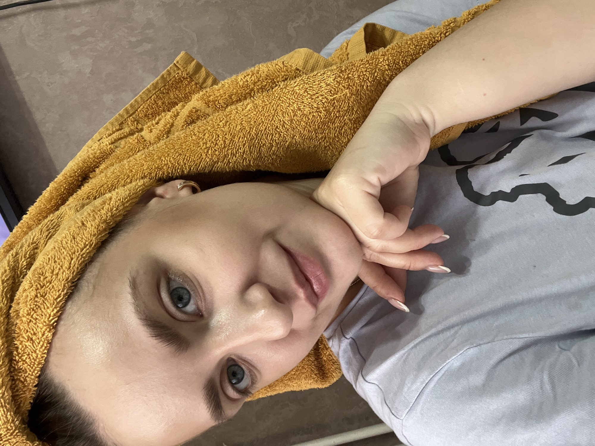 Woman resting with orange towel observed in Марковский, Russia