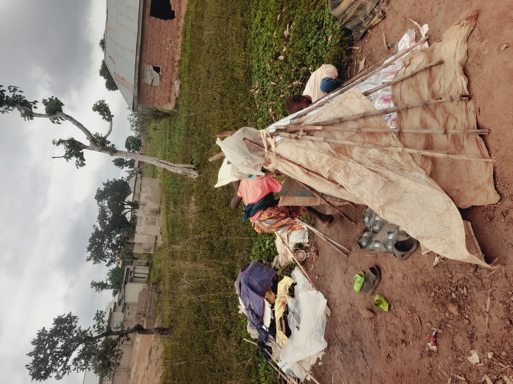 Children build makeshift shelters in Akwanga, Nigeria