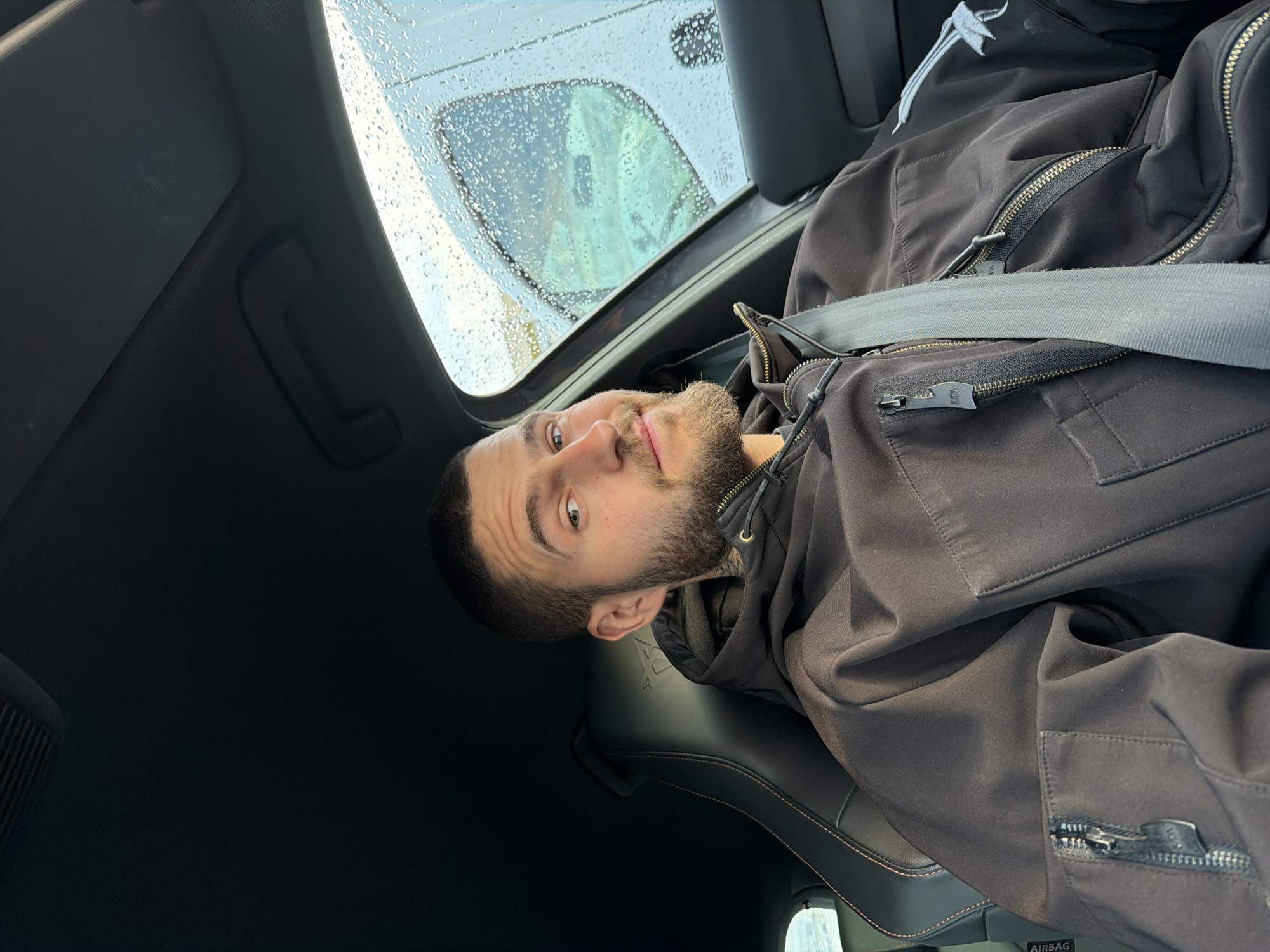 Man observed in car during early morning rain in Sofia