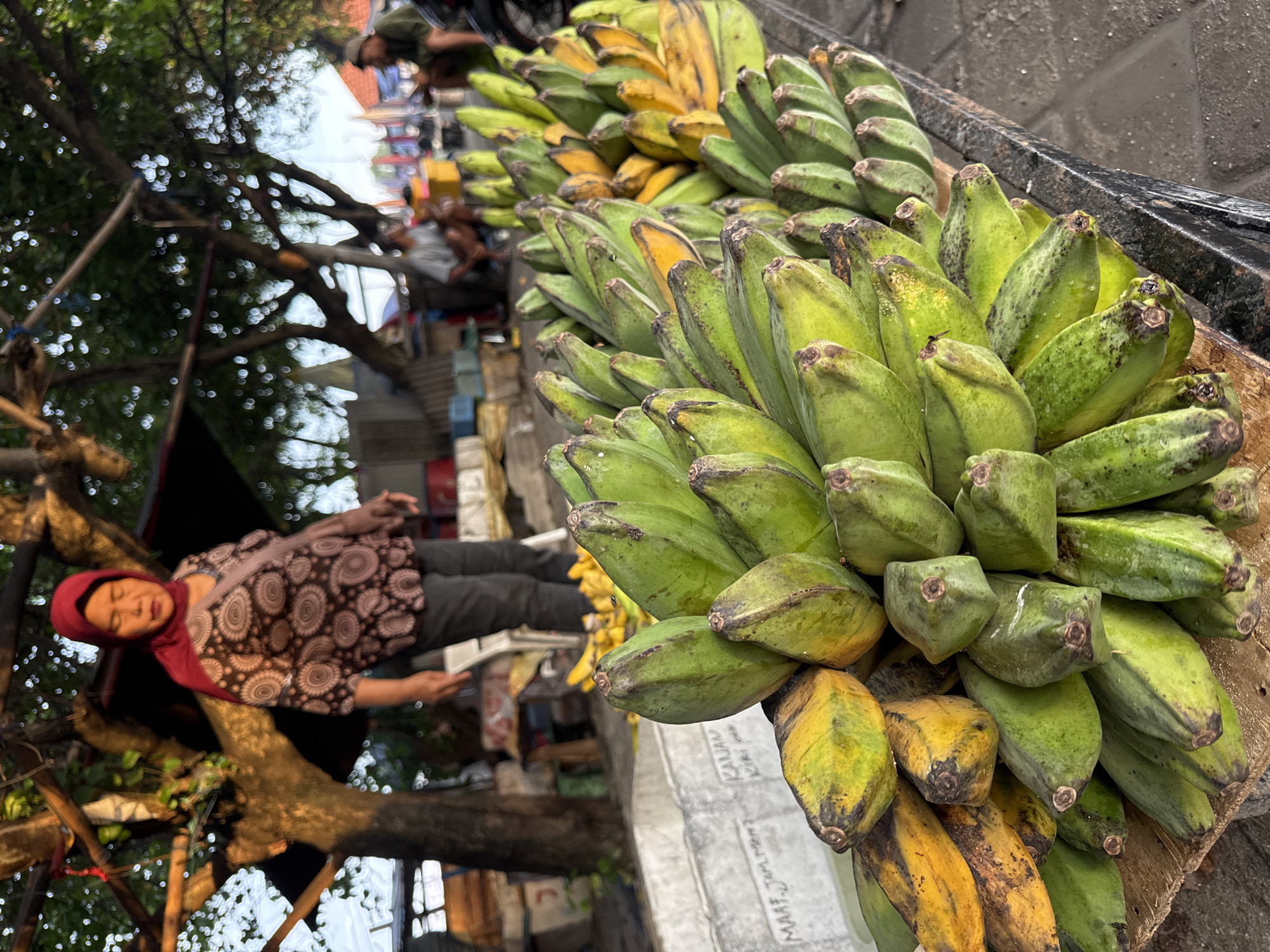 Street scenes, fishing boats, banana vendor documented in Kuta