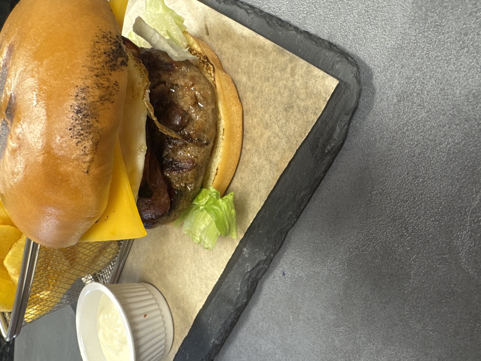 Burger meal photographed on slate tray in Blagoevgrad