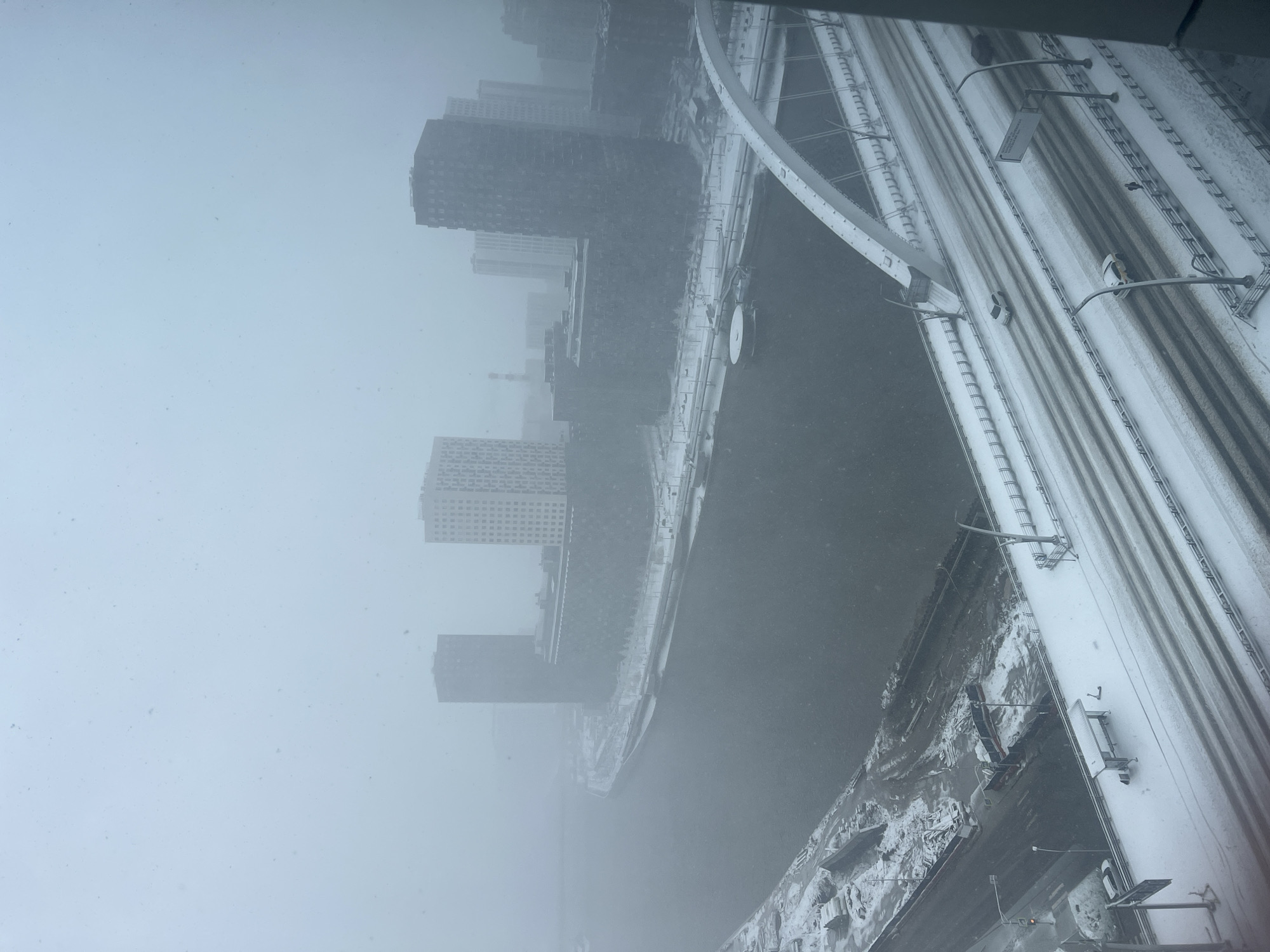 Spring snowstorm blankets Khimki infrastructure, buildings partially obscured