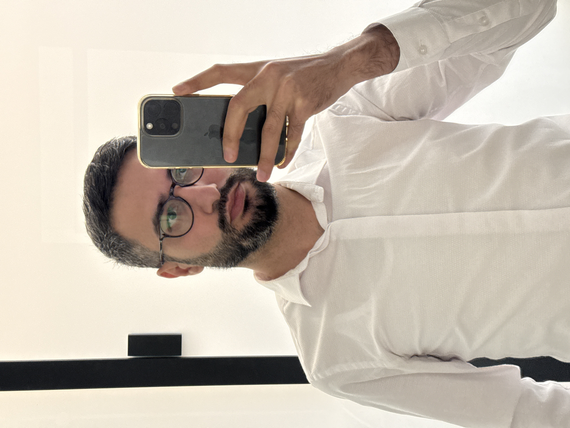 Man takes mirror selfie in Milan indoor location