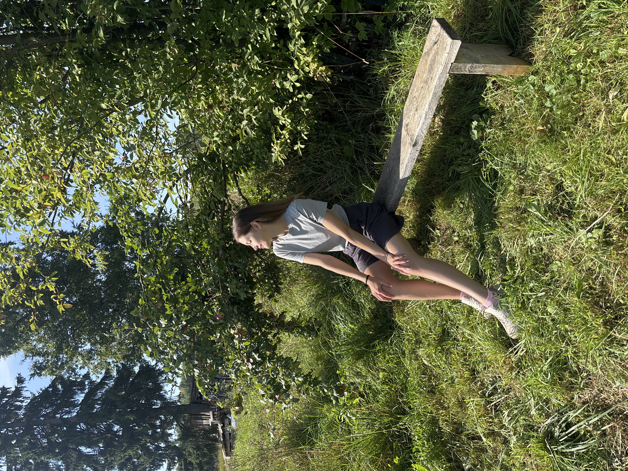 Relaxing on a rustic bench in sunny Васильевское, Russia