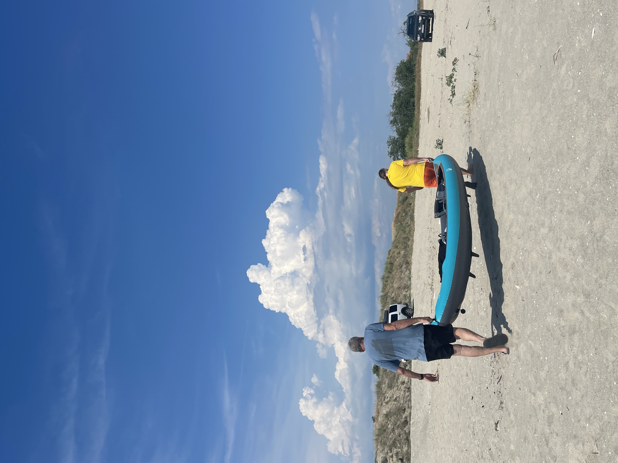 Kayakers and beachgoers enjoy casual afternoon at Agios Georgios