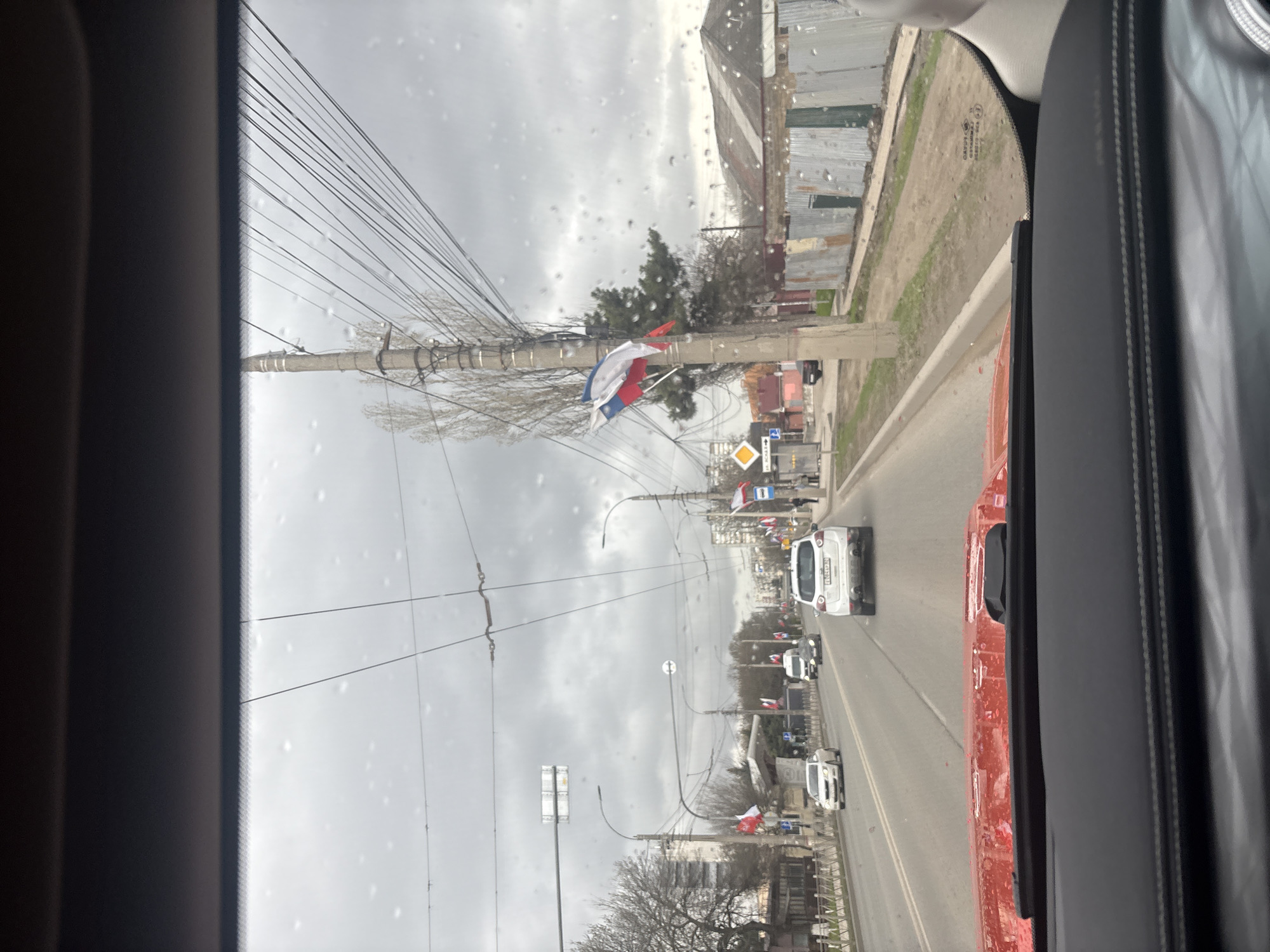 Car journey documented through Simferopol streets during rainy weather