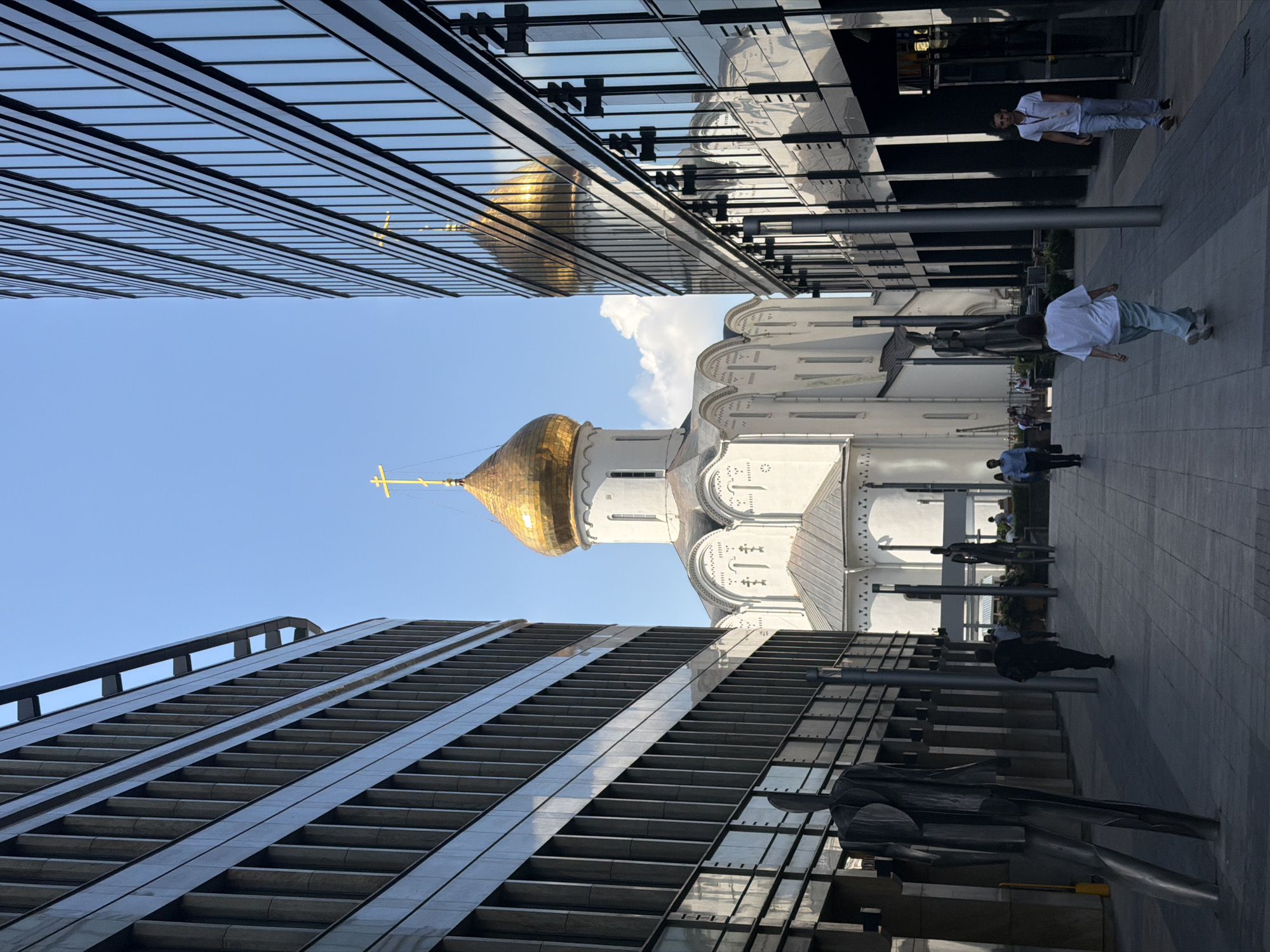 Moscow street life: sculptures, dancing, and a parked bicycle