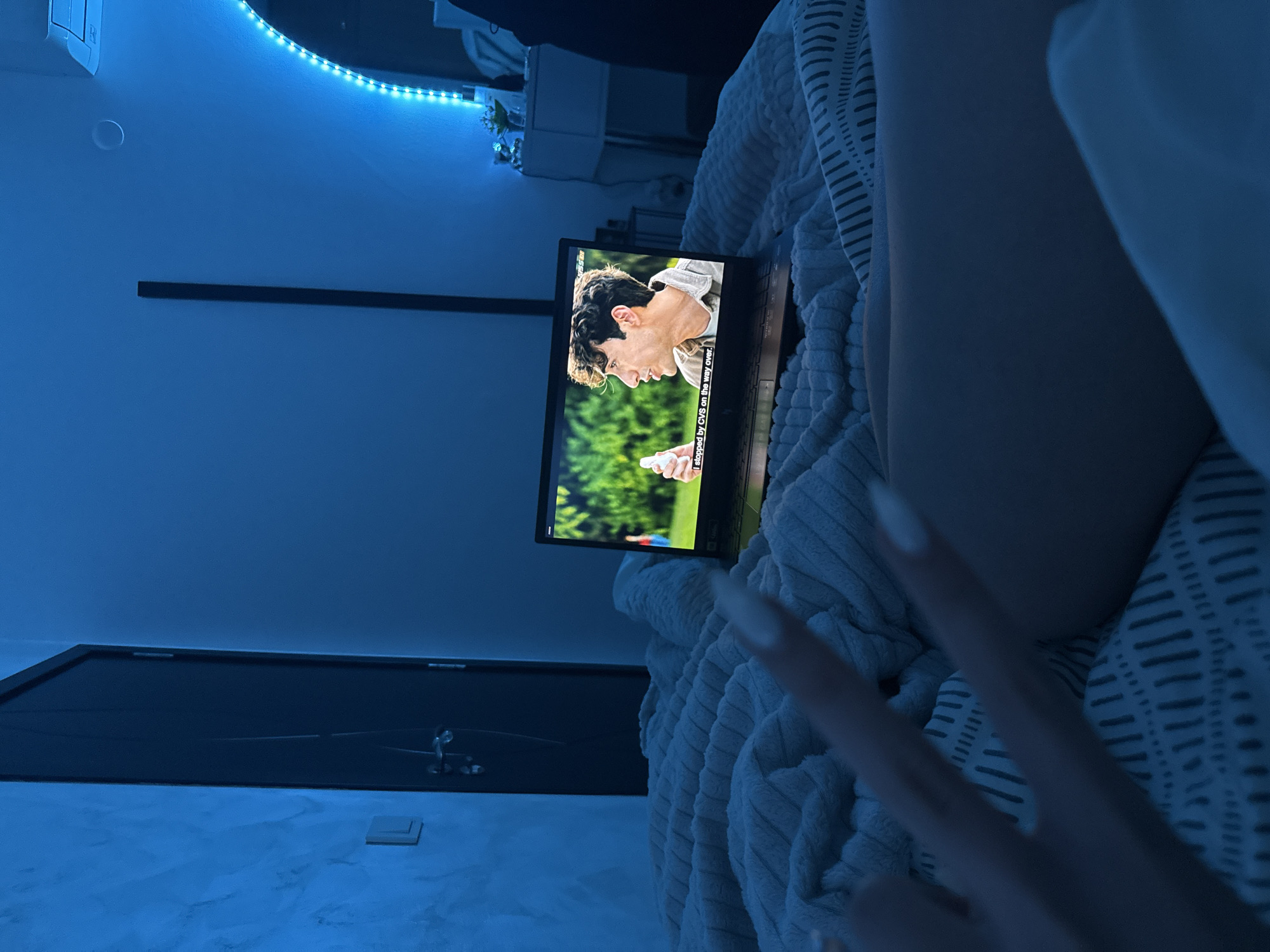 Person watches laptop movies in bed in Blagoevgrad