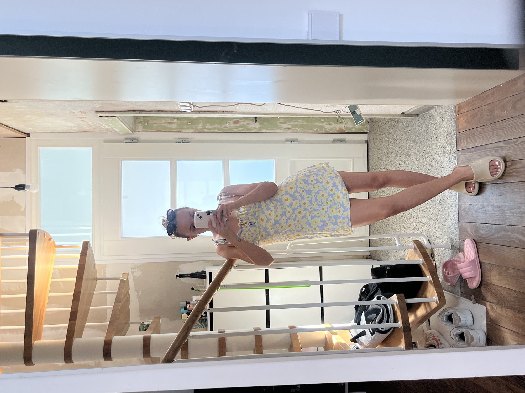 Mirror selfie in a Saarbrücken hallway, floral dress and slides