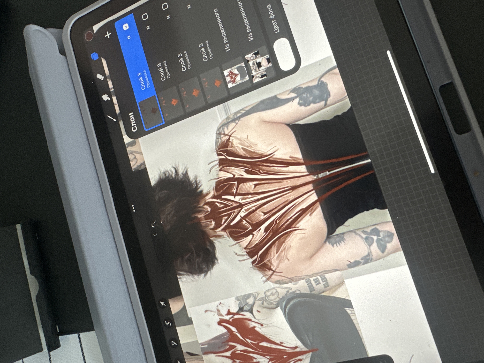 Digital artist works on tattoo-themed artwork in Lyubertsy