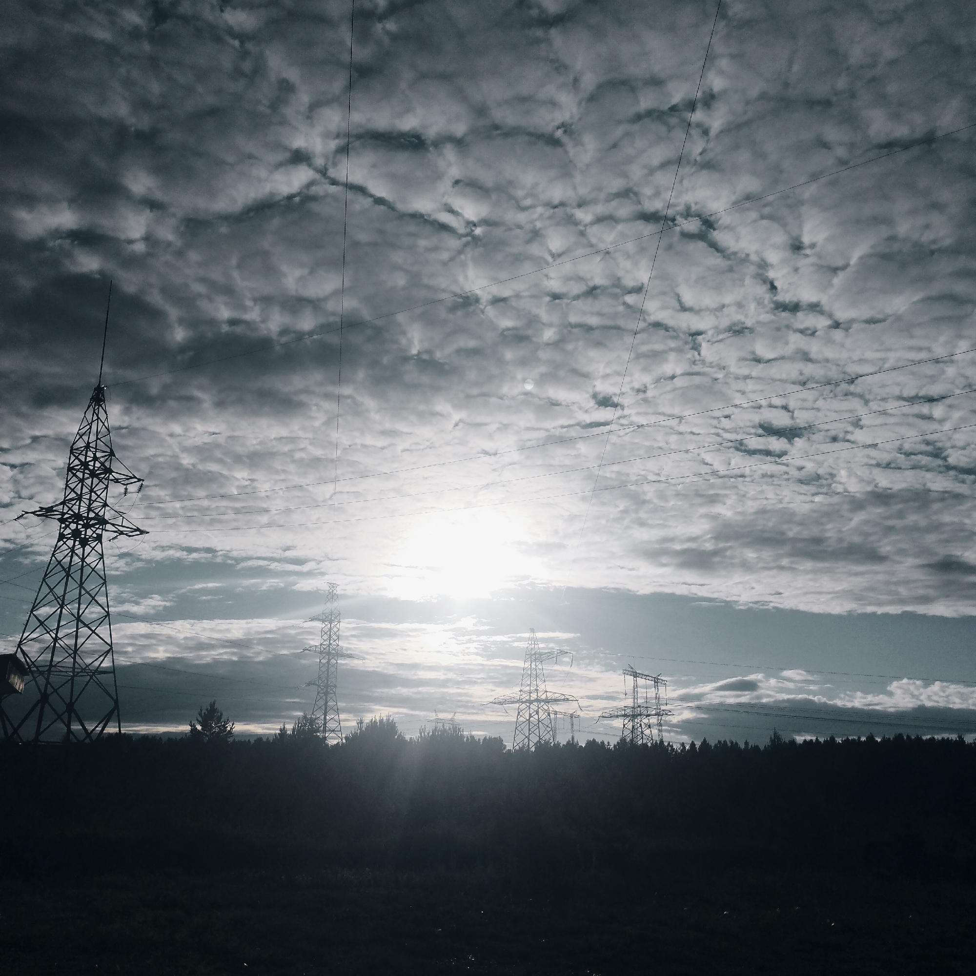 Rural Pokosnoye: pylons, big skies, and golden-hour light