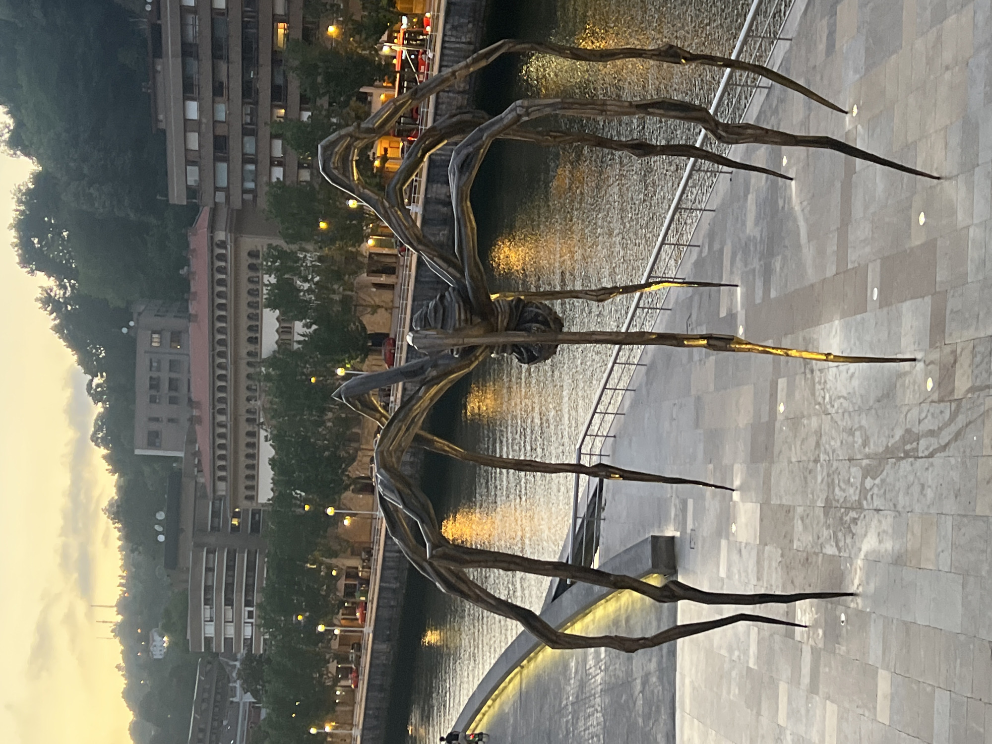 Bilbao's riverfront landmarks at dusk, Guggenheim to Zubizuri