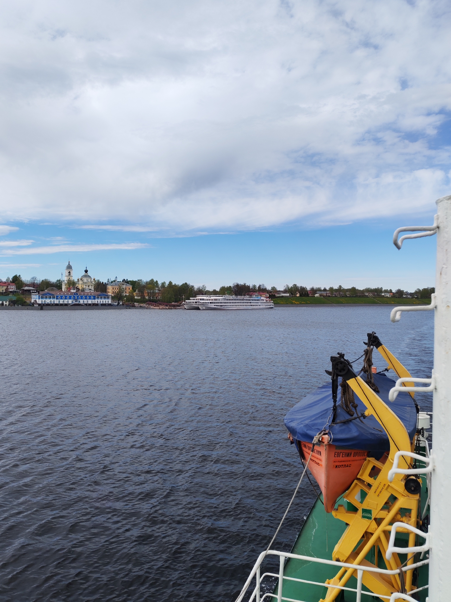 River passenger documents Myshkin cityscape from Volga waters