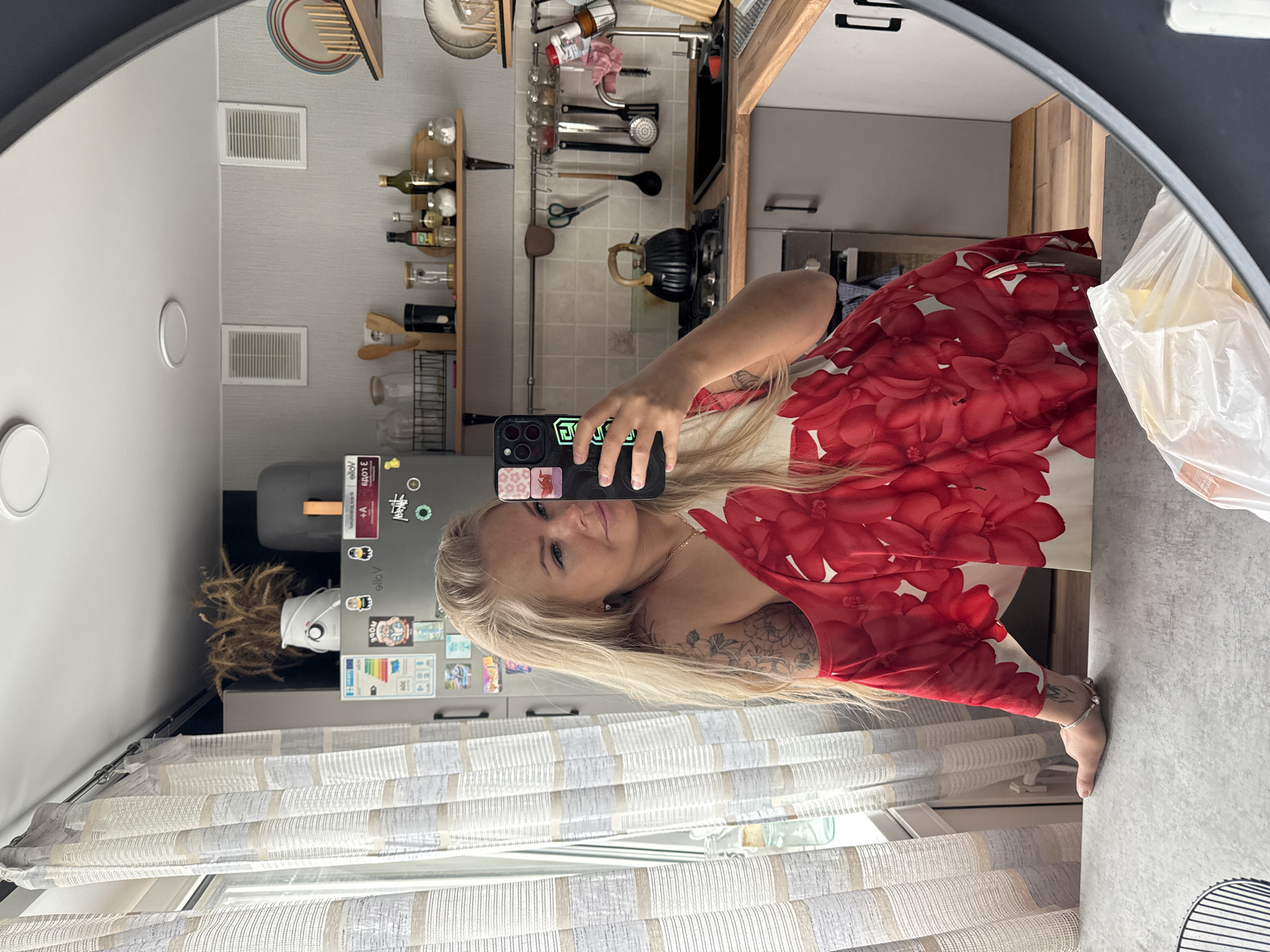Woman takes mirror selfies in different outfits Thursday morning