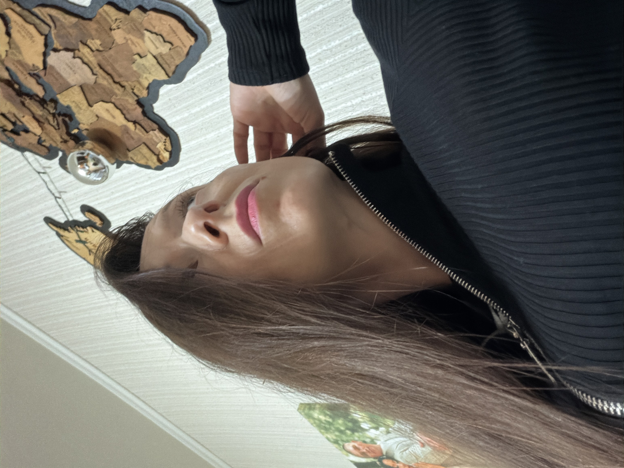 Woman photographed with decorative items in Tuymazy home