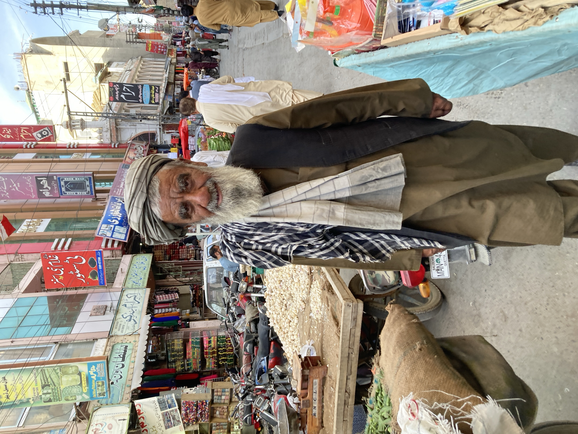 Street scene photographed in Quetta shows man in traditional dress